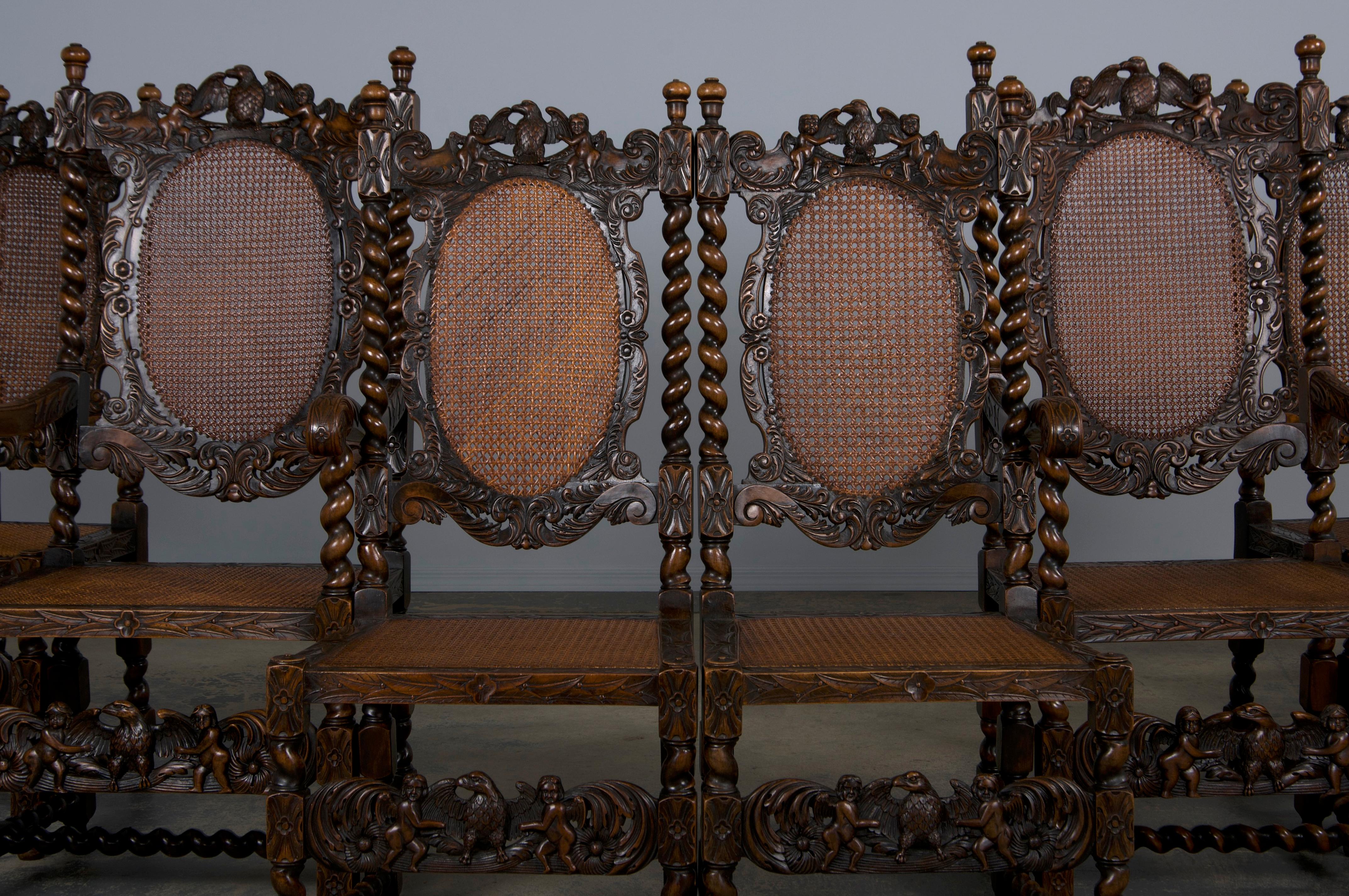 An exquisite set of eight early 19th-century carved dining chairs in the Jacobean Renaissance style, sourced from Provence, France. This set comprises six side chairs and two throne armchairs, all masterfully crafted from solid walnut wood. Each