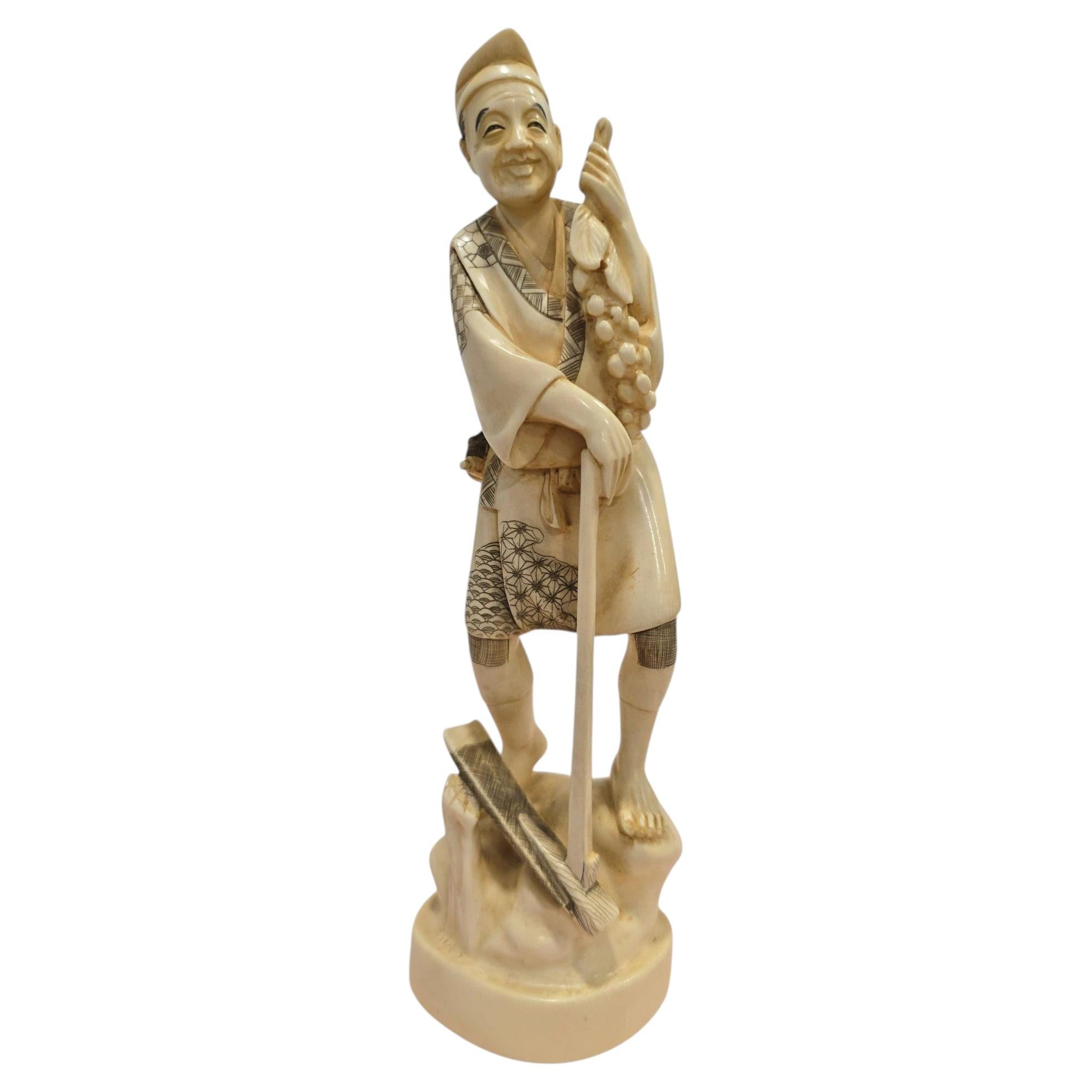 19th Century Japanese Bone Carving of a Grape Seller, Signed For Sale