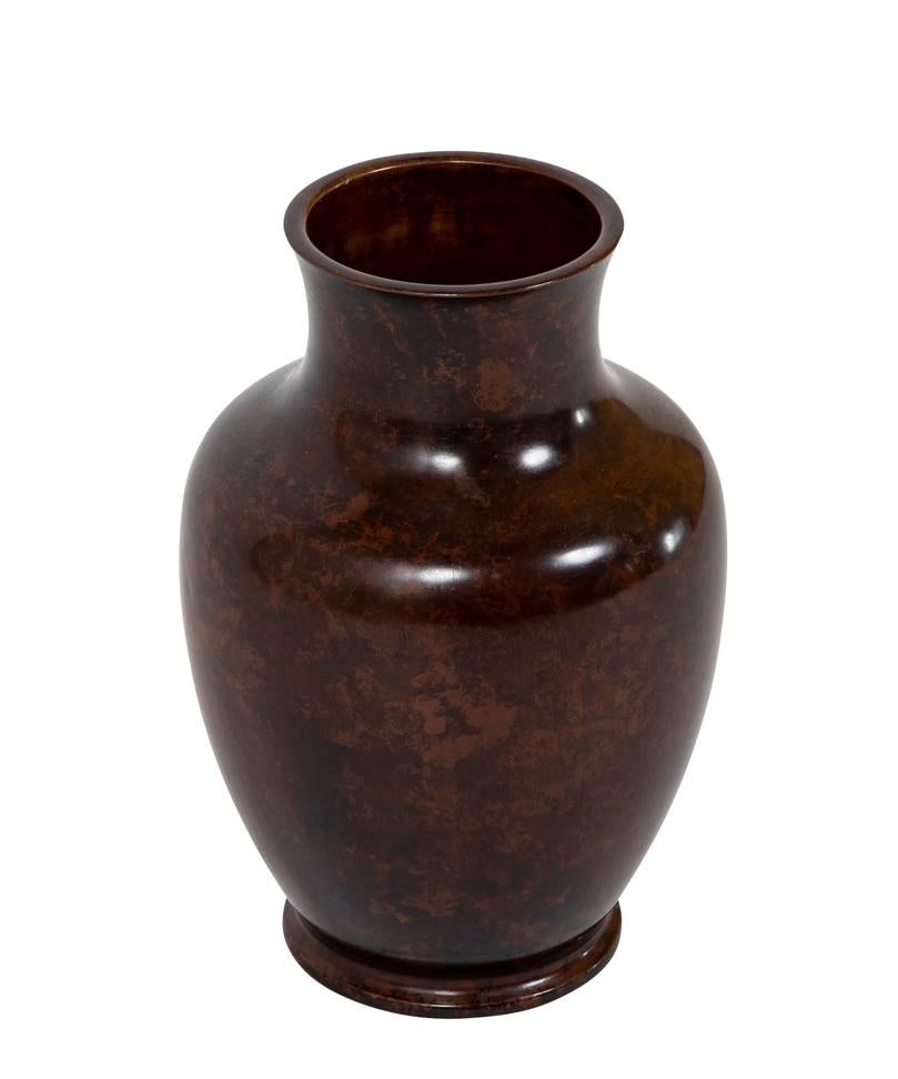 19th century Japanese bronze vase of classic form with a lovely rich patina. The vase has been drilled for wiring as a lamp. It will make a fine lamp or the hole can be plugged and used as a vase. It is also a fine decorative piece as is. 
10.5
