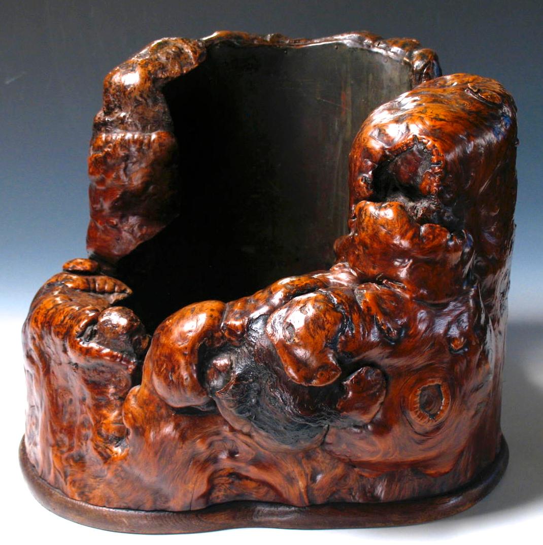 Japanese burl wood hibachi, used as a source of heat in the winter months, a natural form in two tiers of dark brown heavily gnarled skin burl with certain areas revealing the darker core, the lip naturally curled inward, finished with a copper