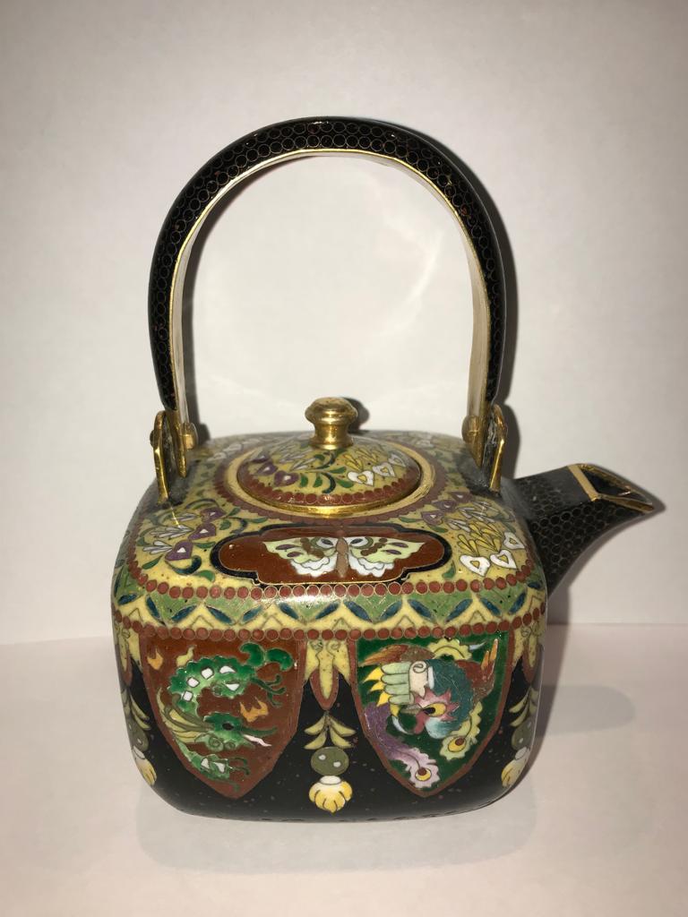 A Japanese cloisonne teapot with what appears to be birds and snake motifs. 

Height 15cm x9.5cm