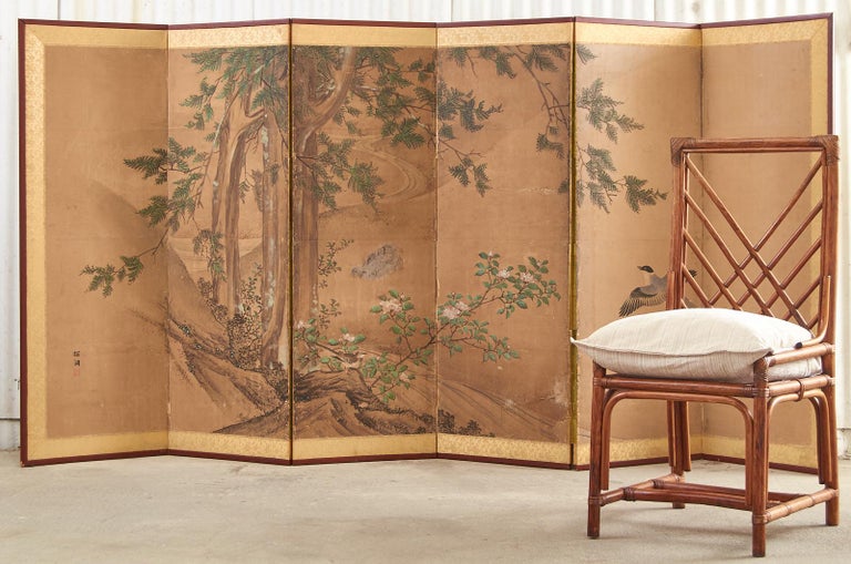 Late Edo period 19th century Japanese six-panel landscape screen featuring a cypress tree over a flowering hibiscus with a pair of hototogisu birds. Kano school painted with ink and natural color pigments on hand-crafted mulberry paper signed by
