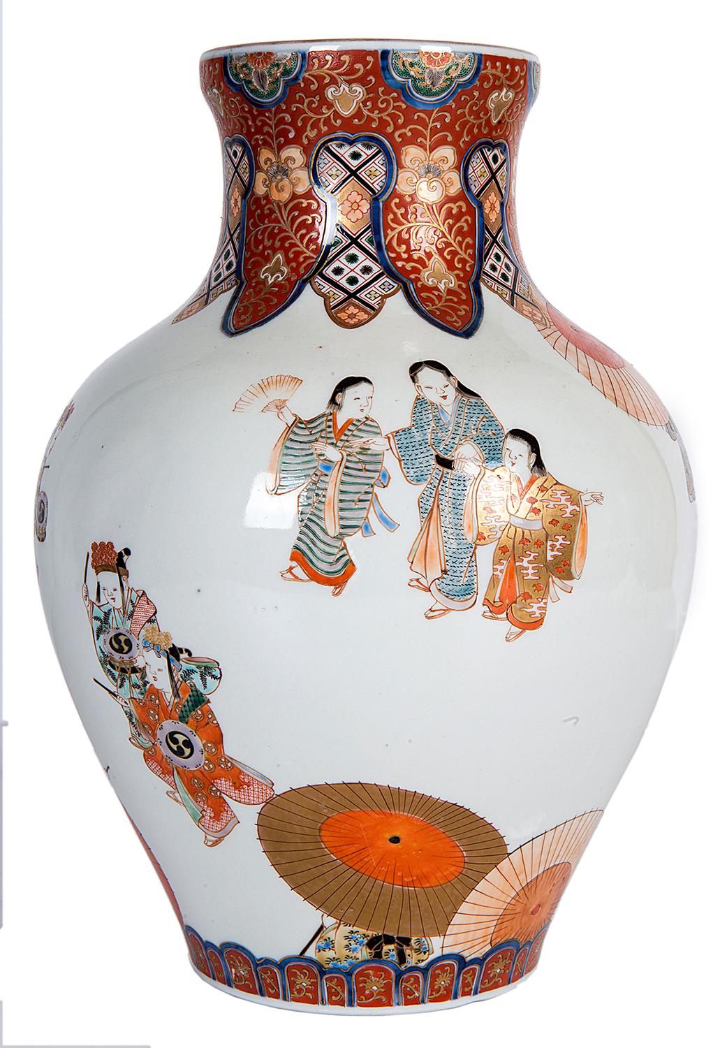 A very good quality Japanese 19th century Fukagawa vase, depicting various classically dress geisha girls and musicians with motifs boarders to top and bottom.