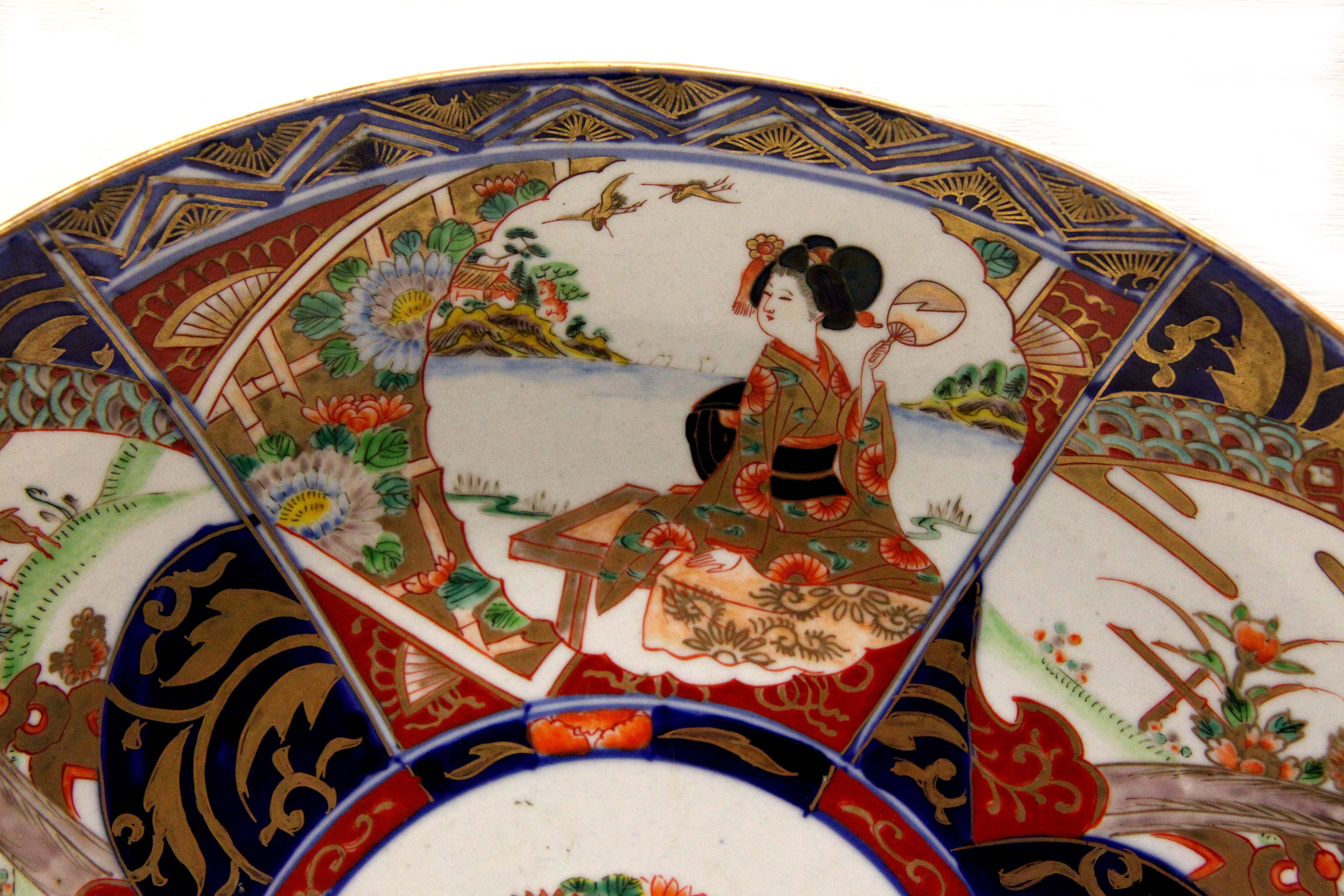 19th century Imari charger, with floral center surrounded by alternating scenes depicting a lady and deer.