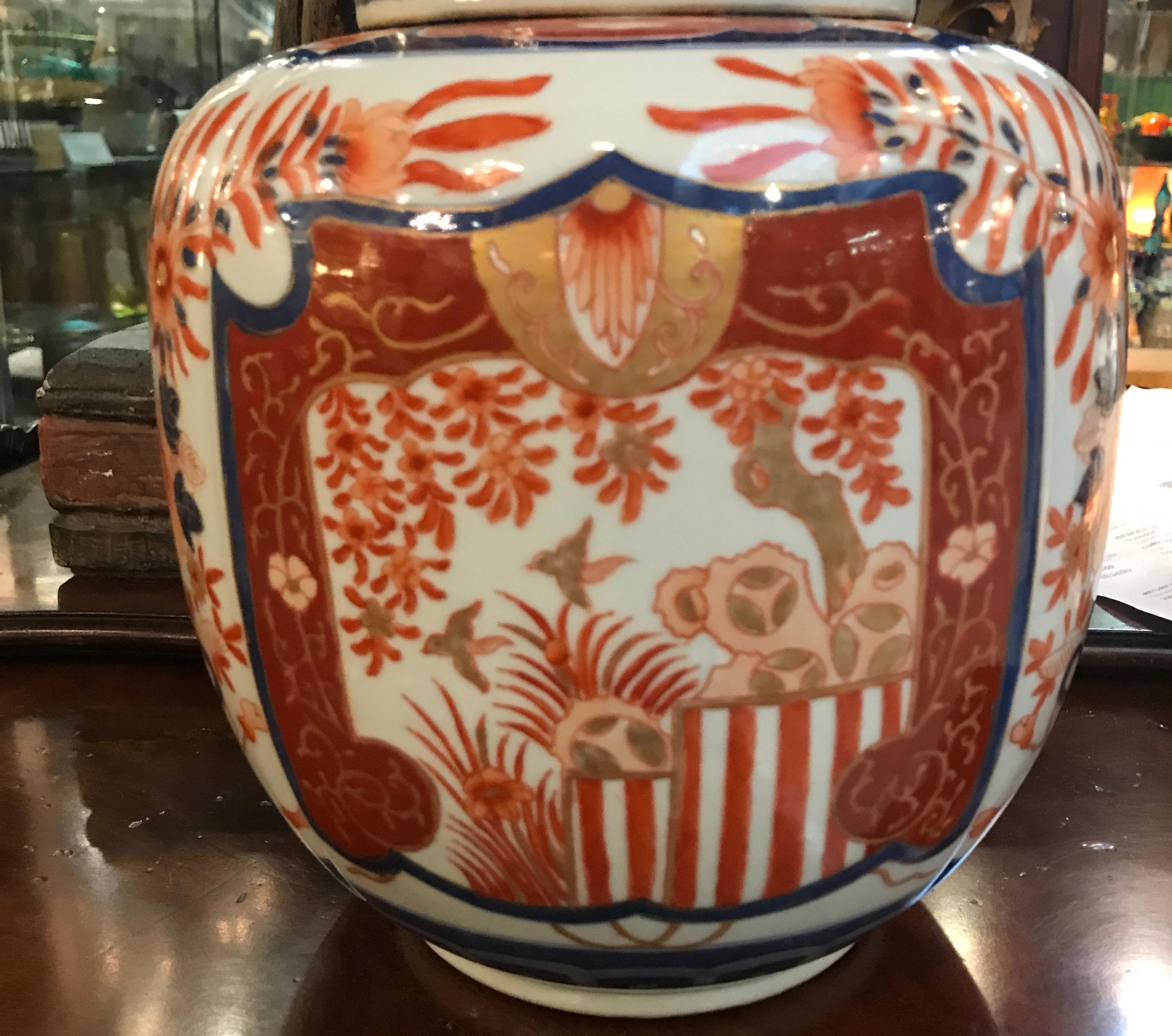 A 19th century Japanese porcelain Imari Jar Meiji period. The Classic iron red and cobalt blue Imari pattern on Japanese white porcelain. The bulbous body with original lid in original and excellent condition.