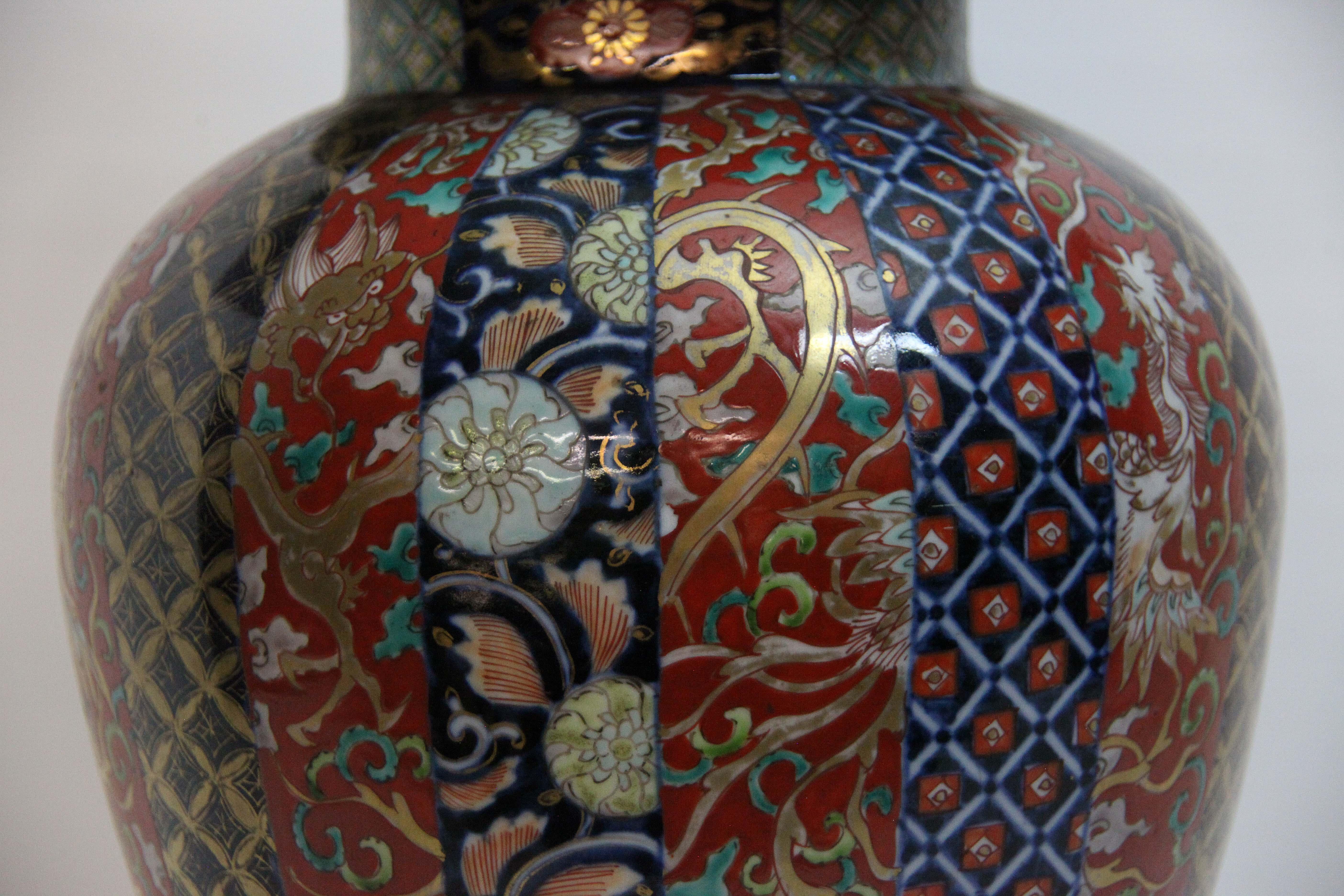 19th century Japanese Imari Temple jar and lid, the baluster form base with repeating vertical stylized designs, the dome lid with the same designs, all in typical Imari colors and patterns.