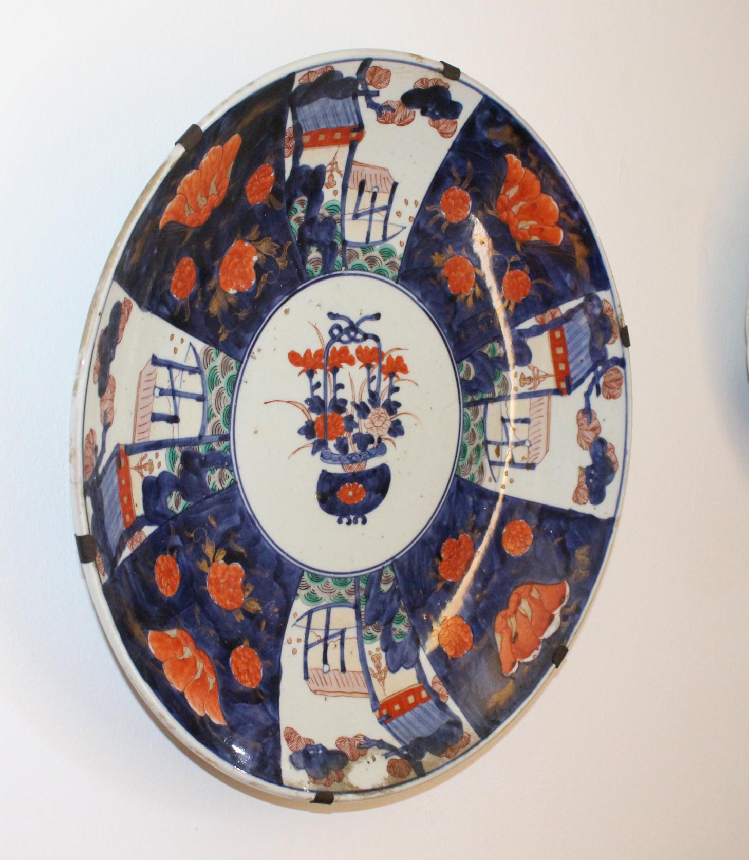 19th century Japanese Imari ware porcelain plate hand painted with typical flower motifs.


