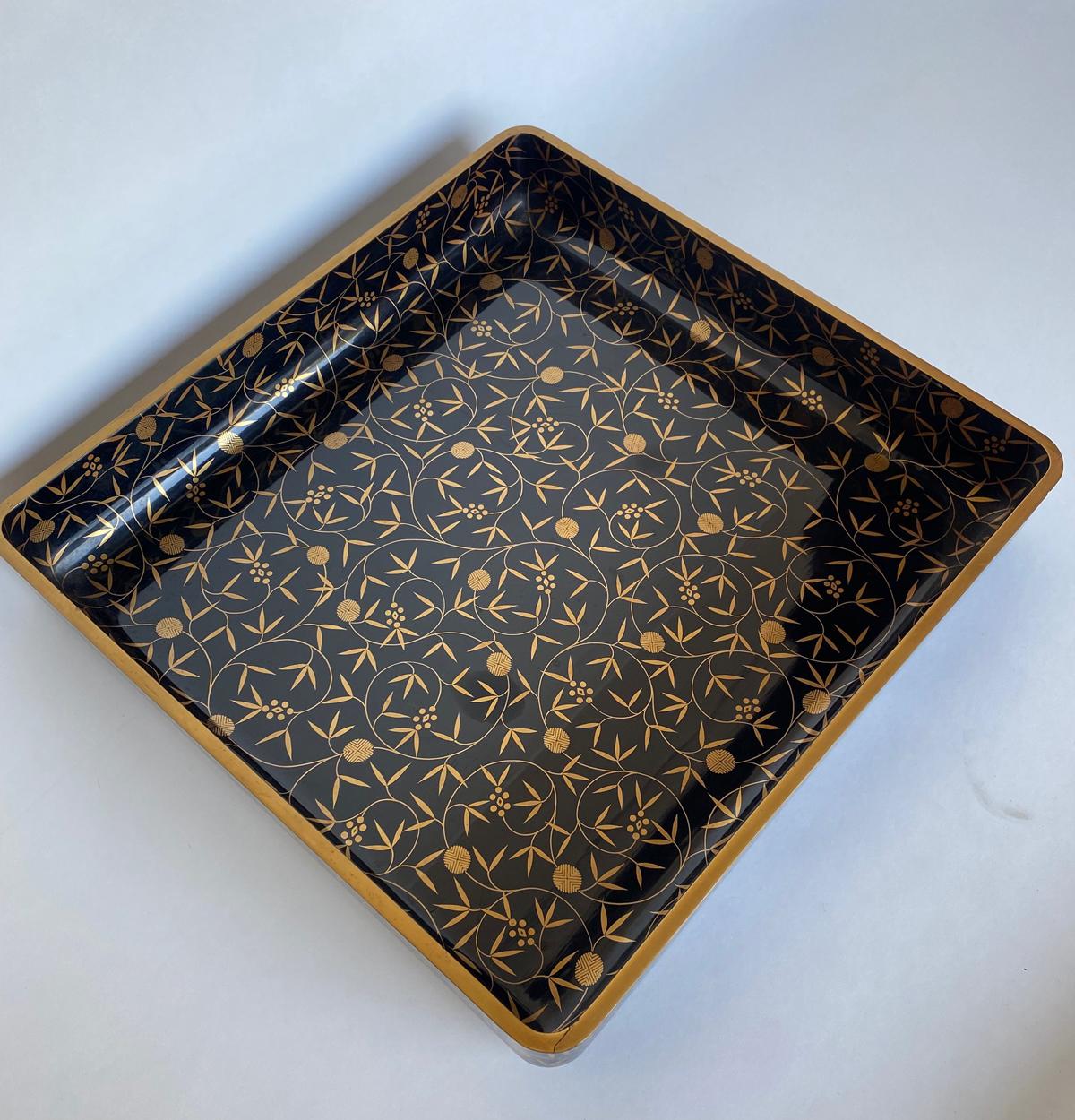 Large scale beautifully hand painted Japanese lacquer tray. The background is deep black and the decorations are in delicate gold. there is a slight warp which can be taken care of with an extra non scratch pad the corner. Fully functional. Would
