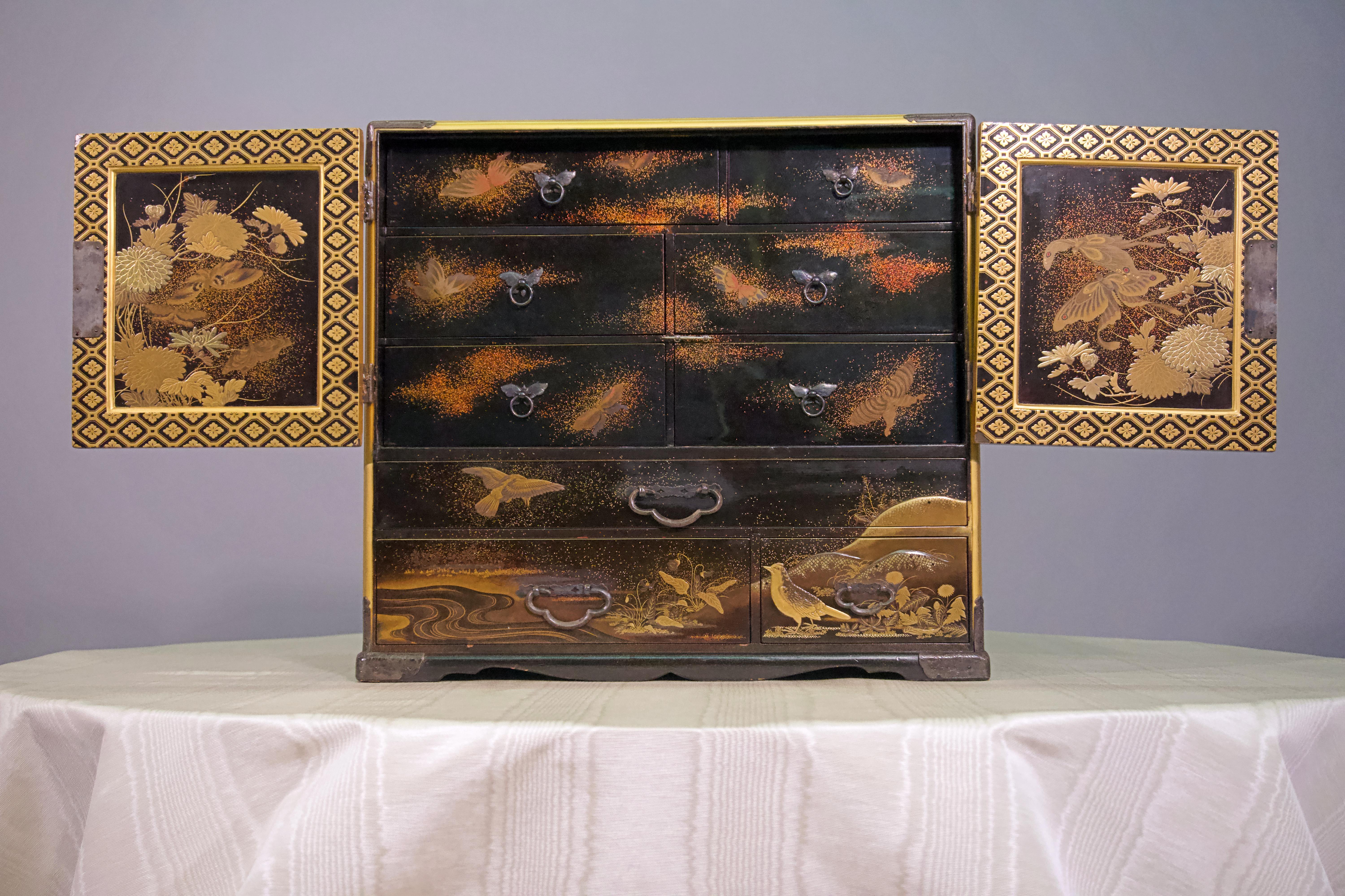 19th century Japanese lacquer miniature cabinet, with brass and gold.