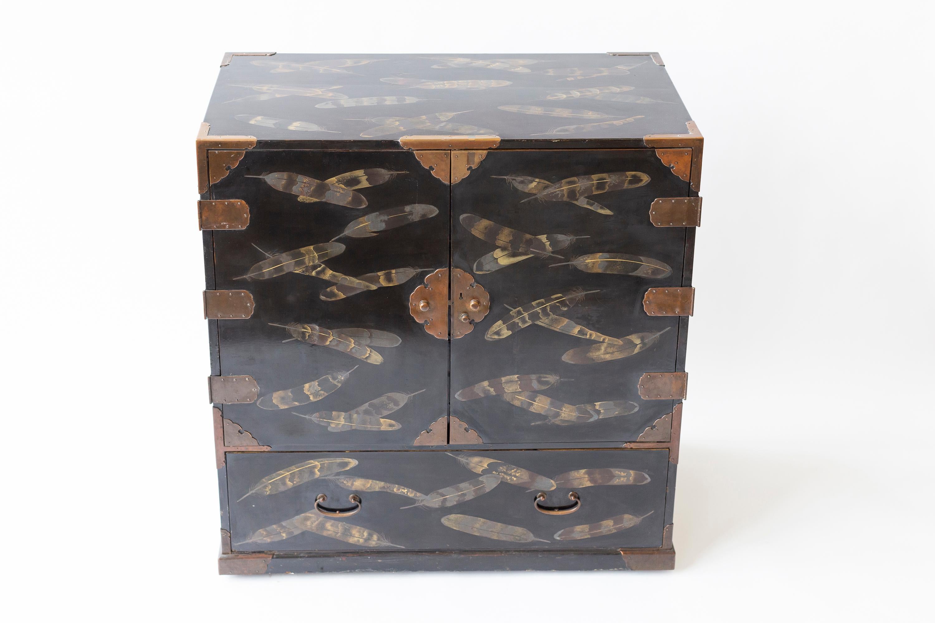 19th century Japanese Edo period togidashi (polished out) lacquered tansu chest. Handpainted with detailed hawk feathers in lacquer, no two feathers are a repeat.  The piece contains a handwritten letter with 