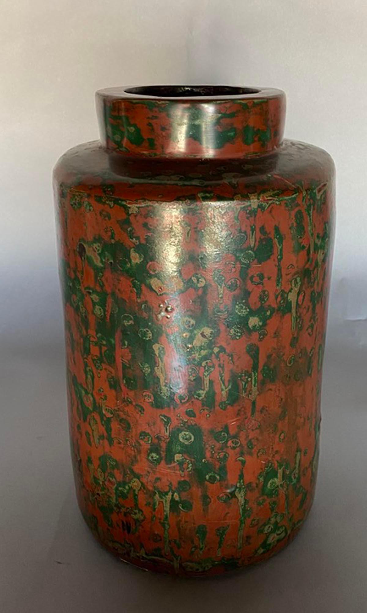 Very unusual lacquered bronze vase from Japan. 
 Interior of the vessel is solid bronze. Exterior is a multicolored lacquer on a dark red field. This striking Taisho to early Showa period vessel is in very good condition.