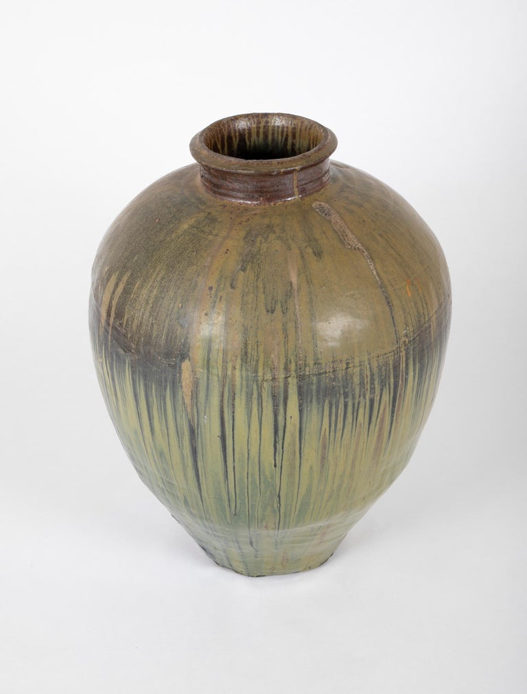 Large scale Japanese ceramic storage jar with beautiful green drip glaze. It takes real skill to fire a jar of this size. This can be placed outdoors in the garden or on a patio as a planter or decorative urn. Or indoors as a stunning vase or