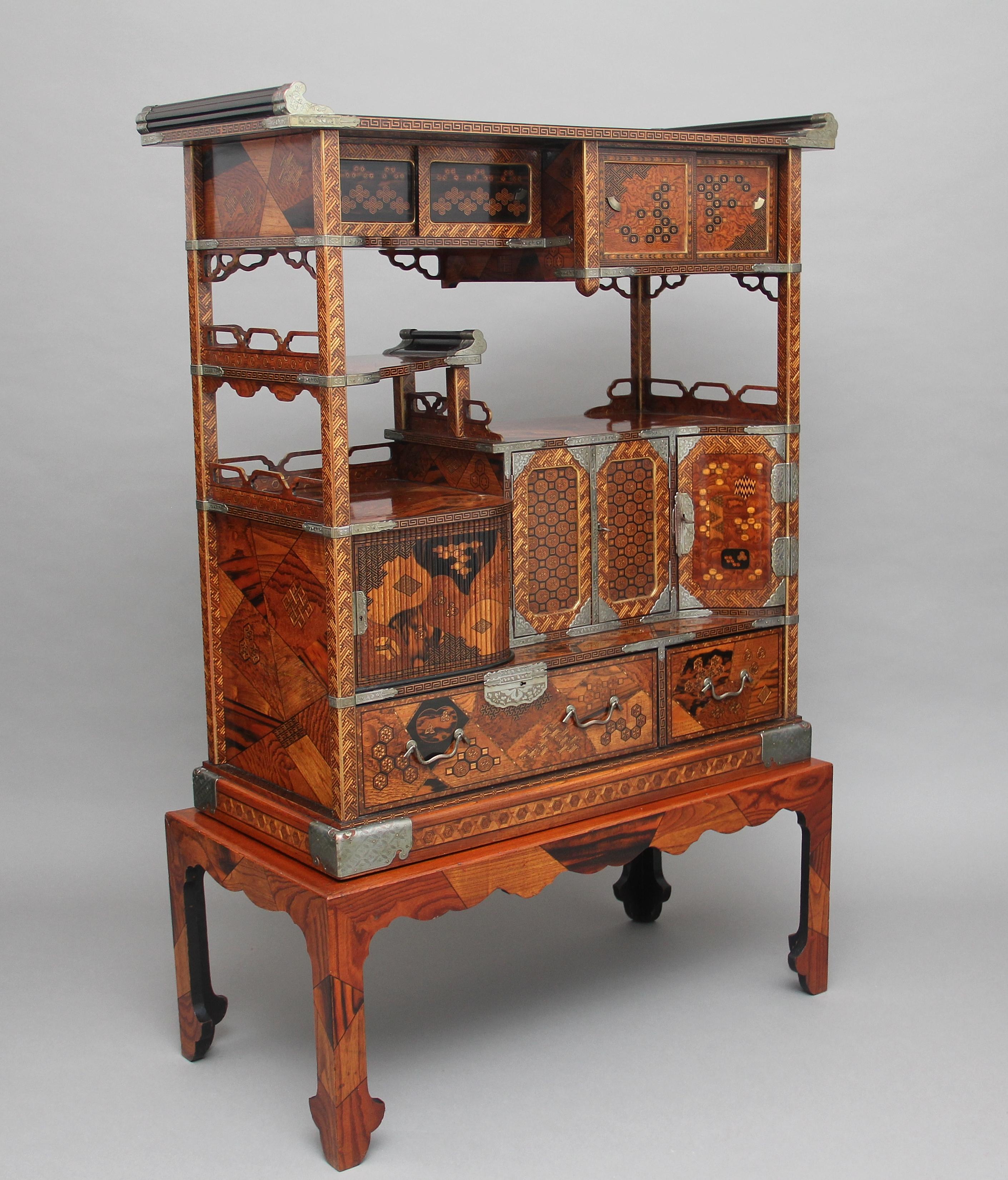 A fabulous quality late 19th century Japanese marquetry cabinet, inlaid and veneered in exotic woods, this is without doubt the best quality of it’s kind, the inlay is amazing and the mounts are silvered on copper, there are sliding doors on