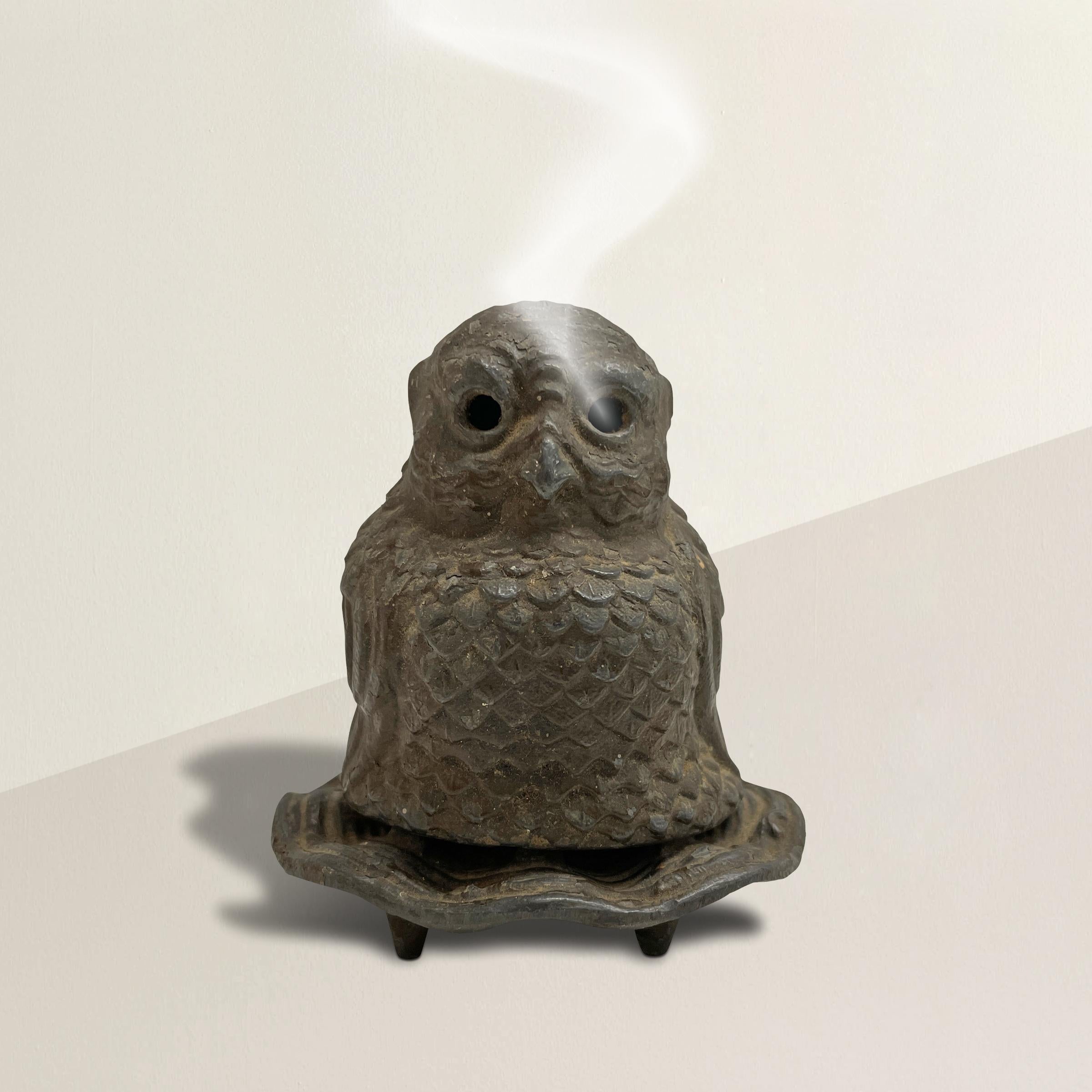 An eerie yet compelling late 19th century Japanese owl incense burner with a rather plump owl sitting in a nest. Supports on the nest raise the owl slightly to allow airflow underneath so the smoke can escape through the eyes. This piece was made