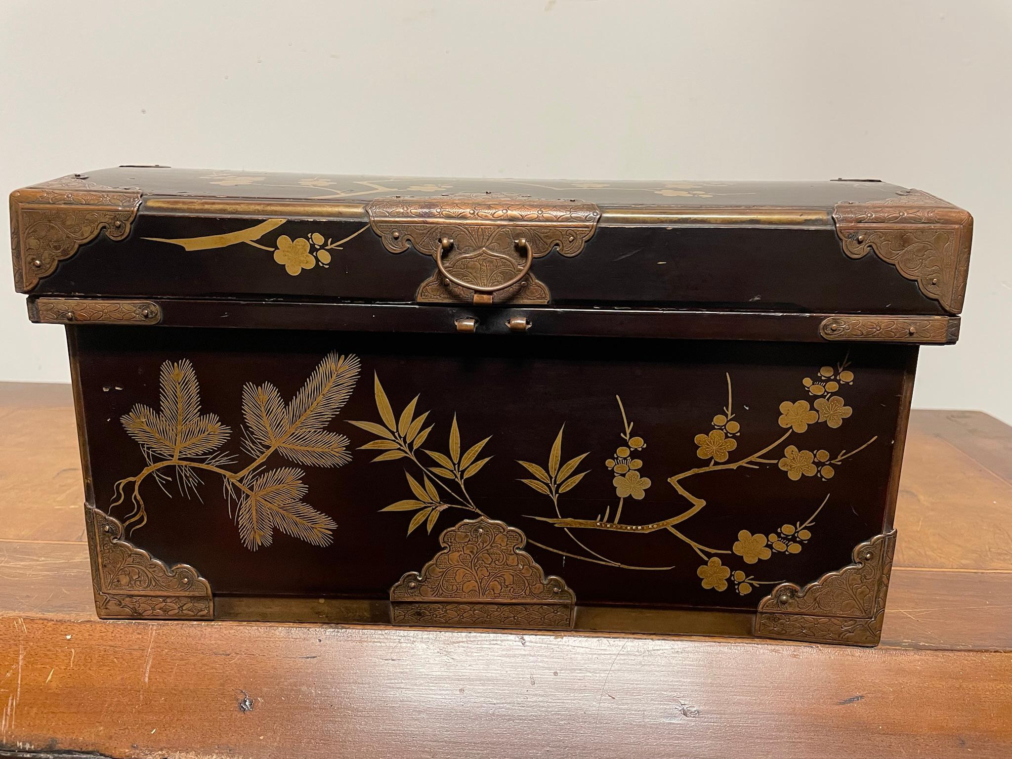 Lovely dome top Japanese plum lacquer box with beautiful cherry blossom, bamboo and mimosa decoration. Take a good look at the detail in the gilding, really quite stunning work. Some of the branches are inlaid with little squares of gold. 
With