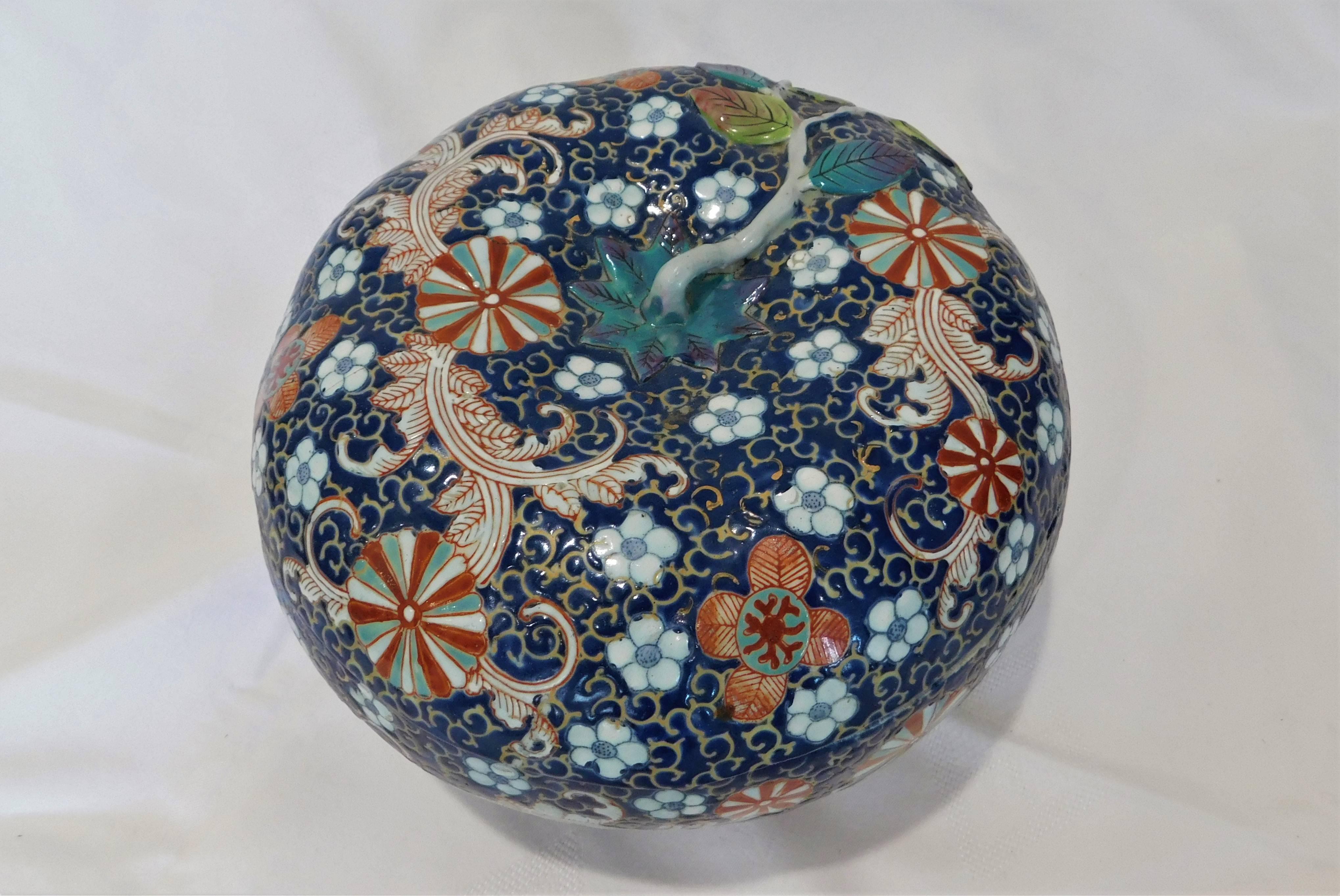 Japanese porcelain floral bowl is in the shape of a gourd with lid.
