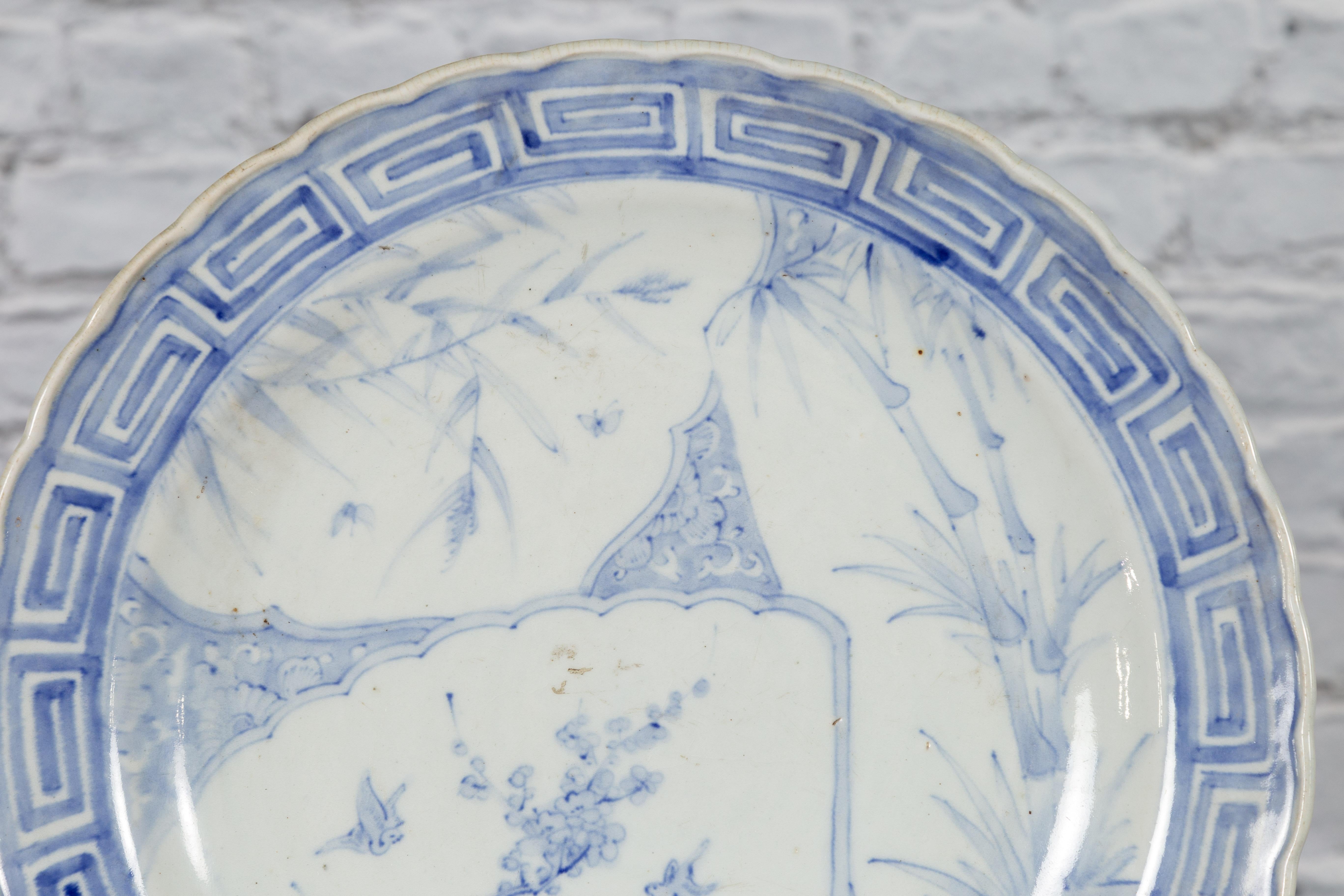 Hand-Painted 19th Century Japanese Porcelain Plate with Blue and White Bird and Bamboo Motifs For Sale