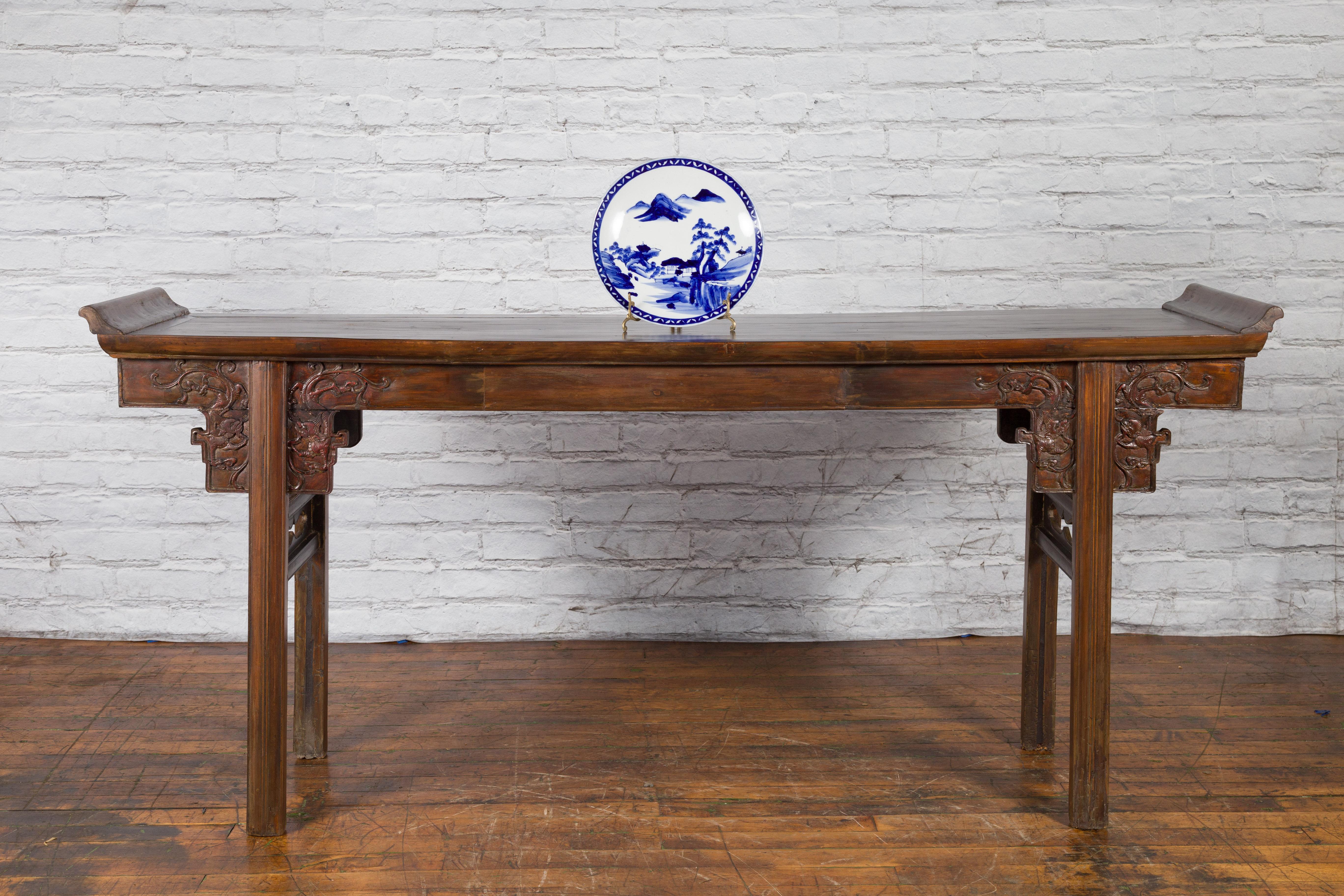 A Japanese hand-painted porcelain plate from the 19th century, with blue and white landscape and architecture décor. Created in Japan during the 19th century, this porcelain plate features a delicate blue and white décor depicting a houses hidden in