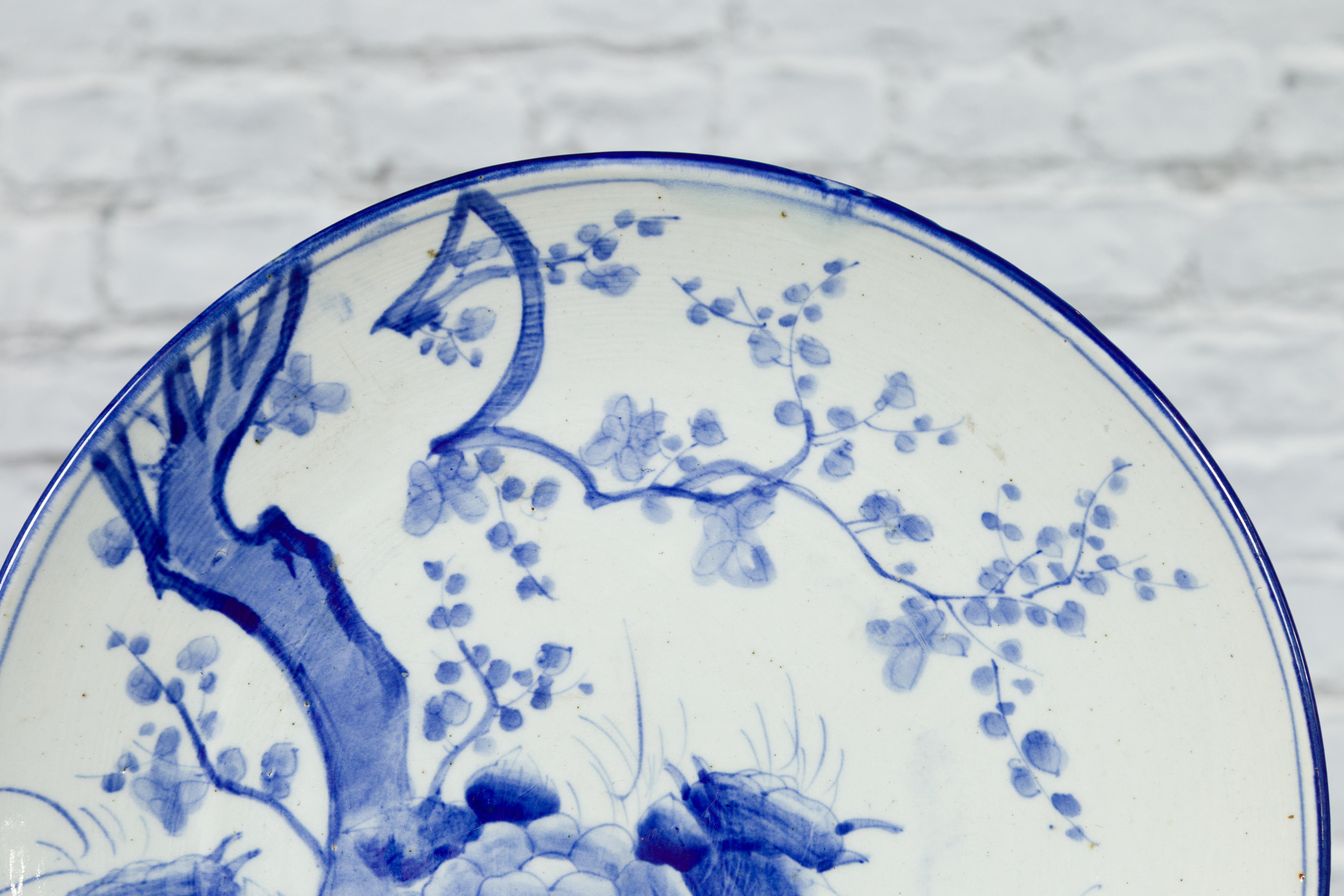 19th Century Japanese Porcelain Plate with Hand-Painted Blue and White Décor In Good Condition For Sale In Yonkers, NY