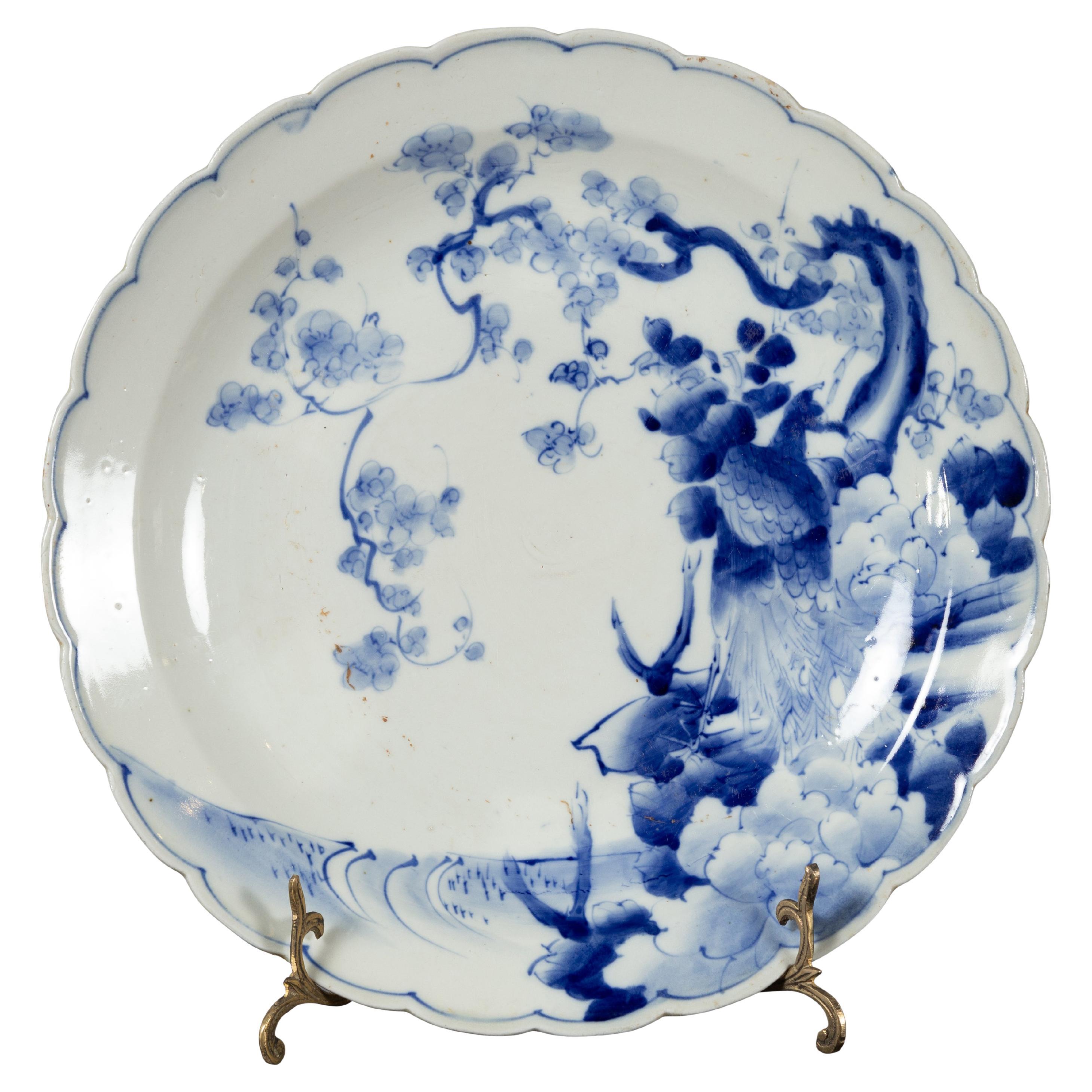19th Century Japanese Porcelain Plate with Hand-Painted Blue and White Décor For Sale