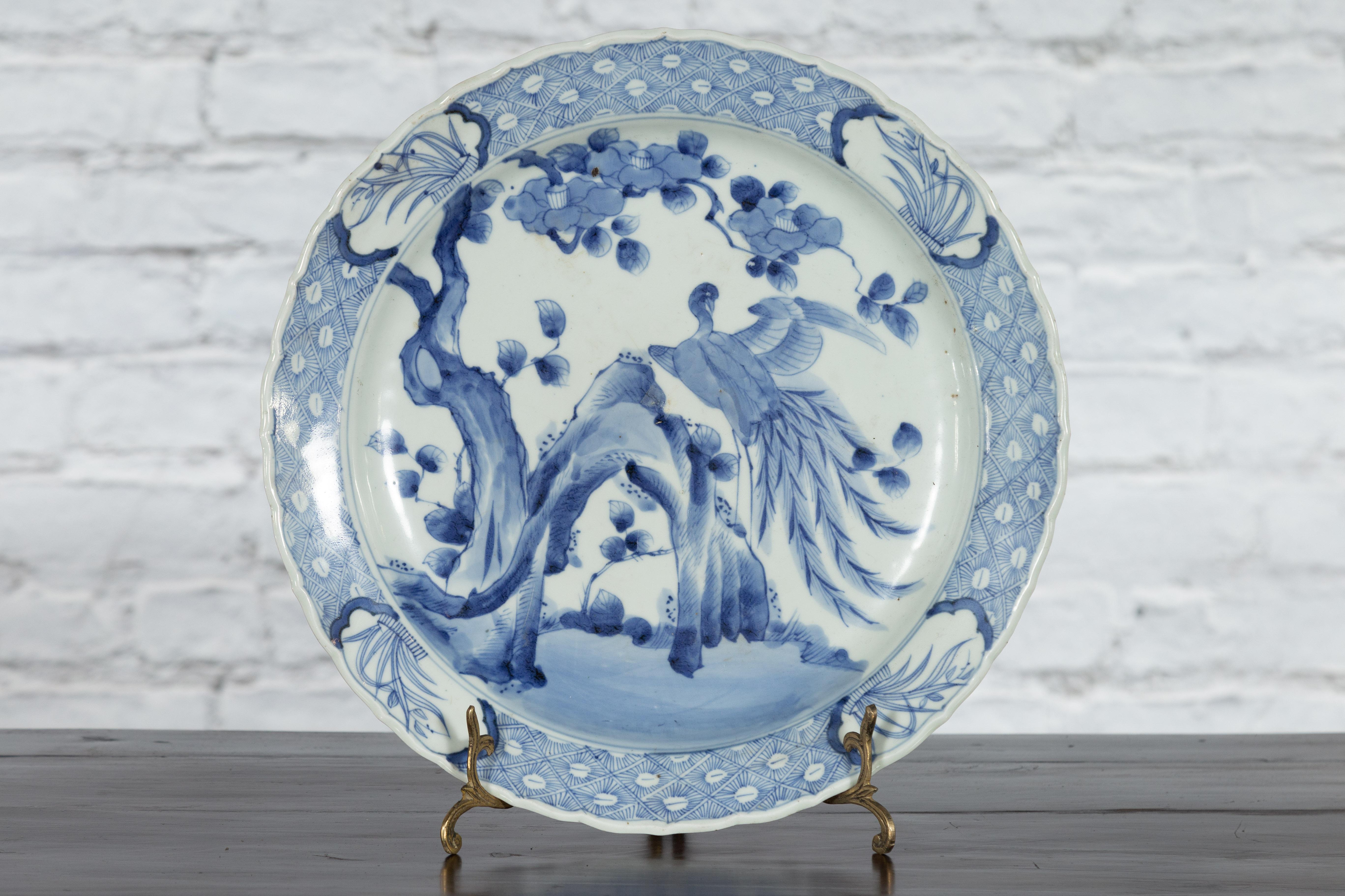 Hand-Painted 19th Century Japanese Porcelain Plate with Painted Blue and White Bird Décor For Sale