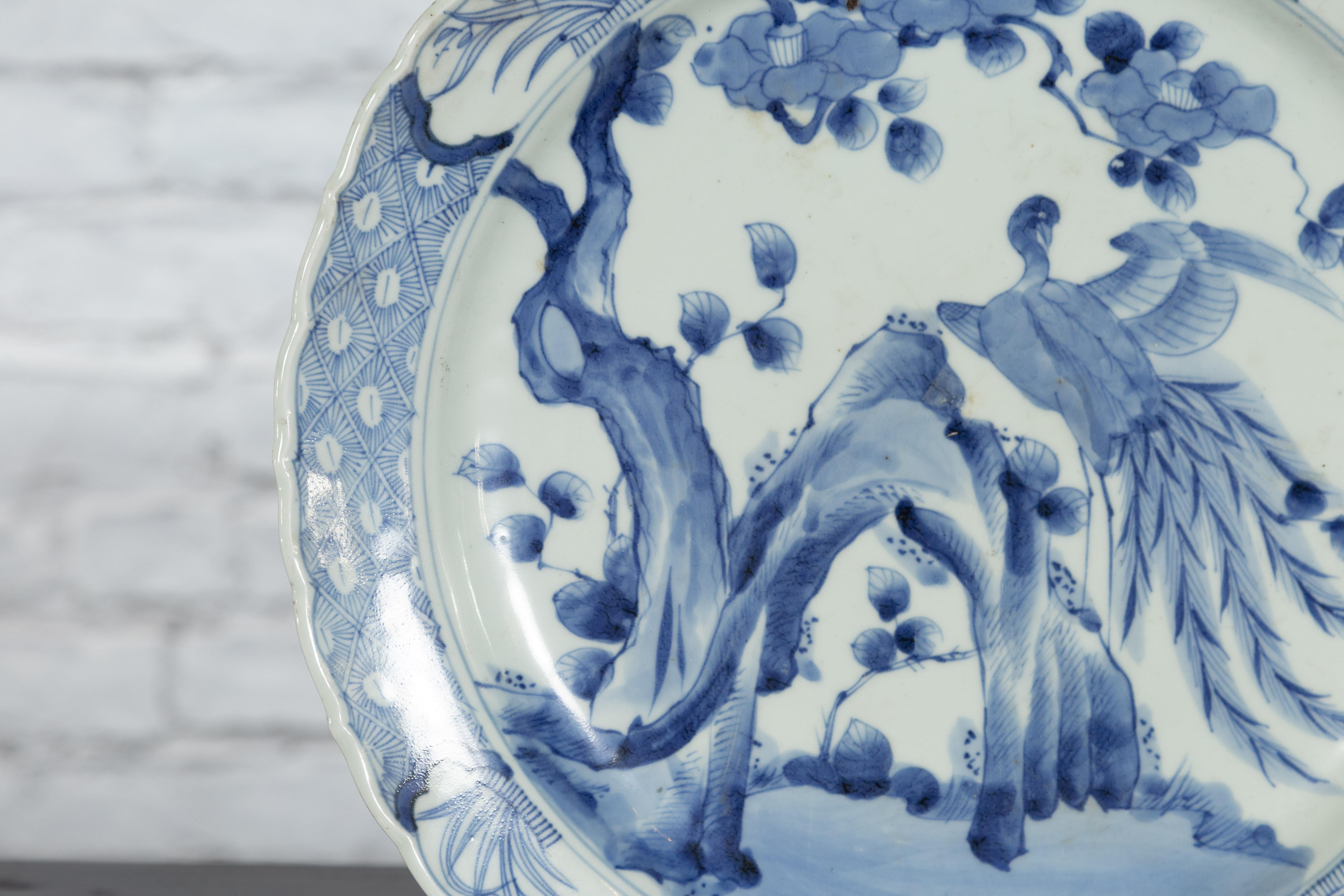 19th Century Japanese Porcelain Plate with Painted Blue and White Bird Décor For Sale 2
