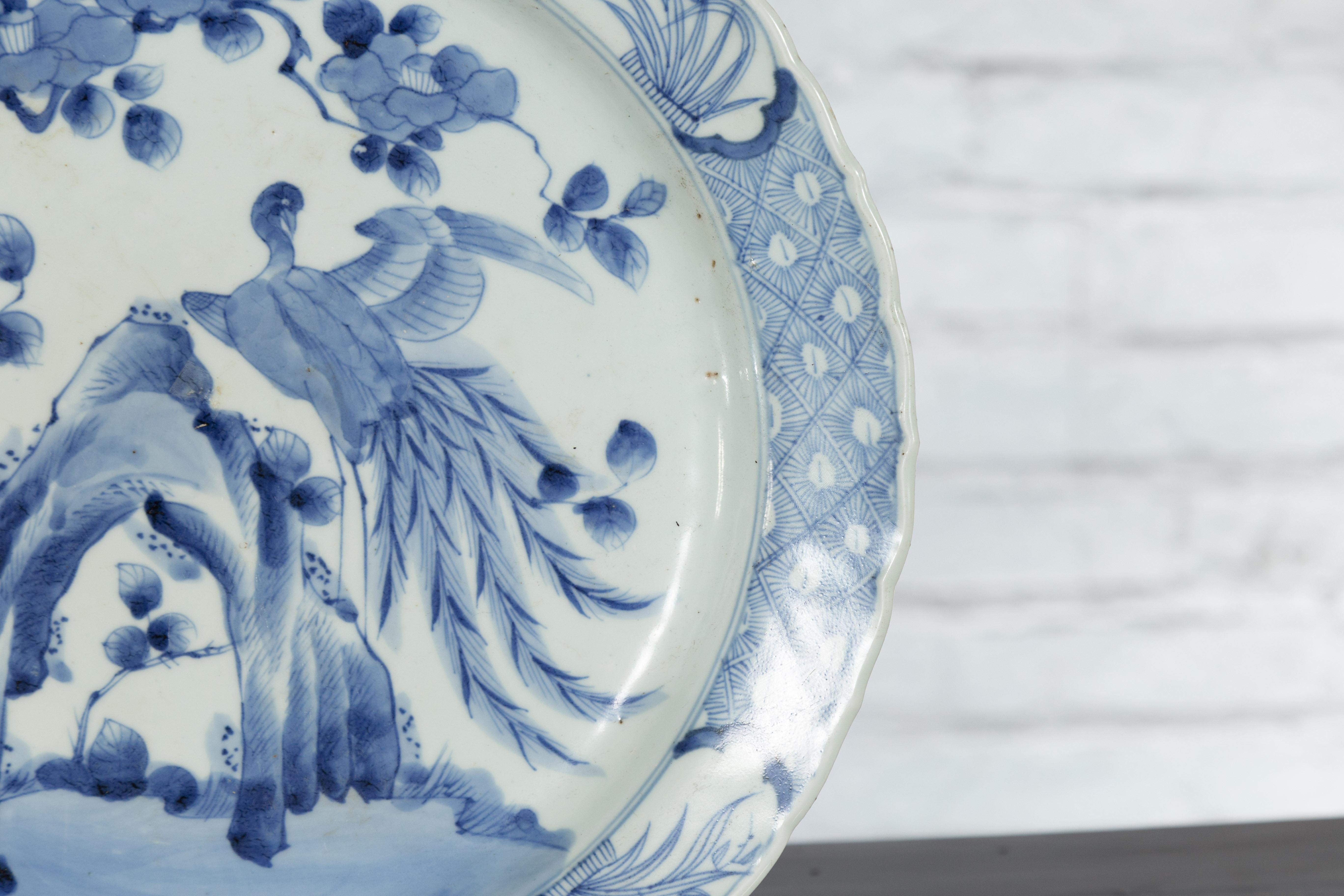 19th Century Japanese Porcelain Plate with Painted Blue and White Bird Décor For Sale 3