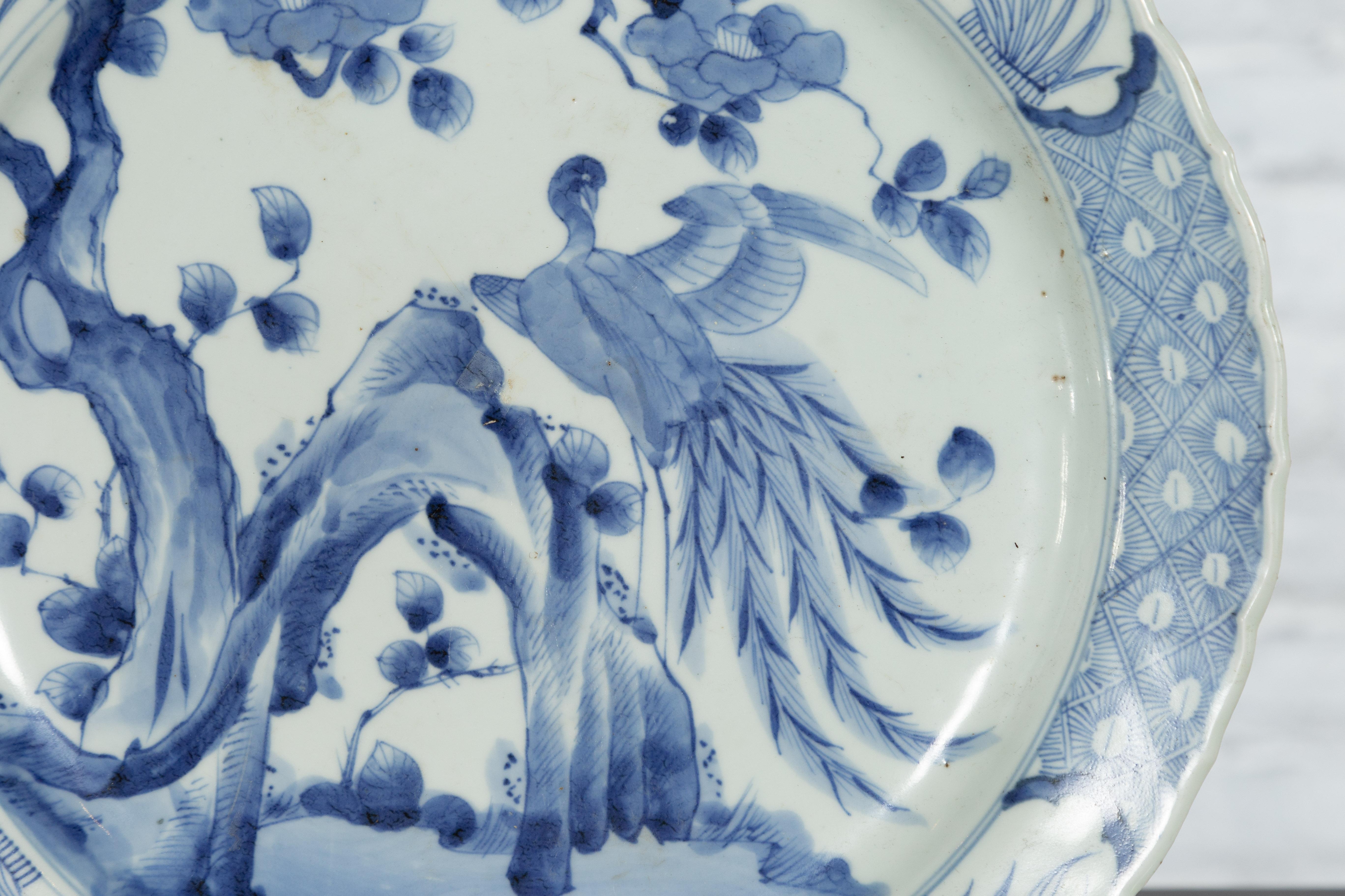 19th Century Japanese Porcelain Plate with Painted Blue and White Bird Décor For Sale 4