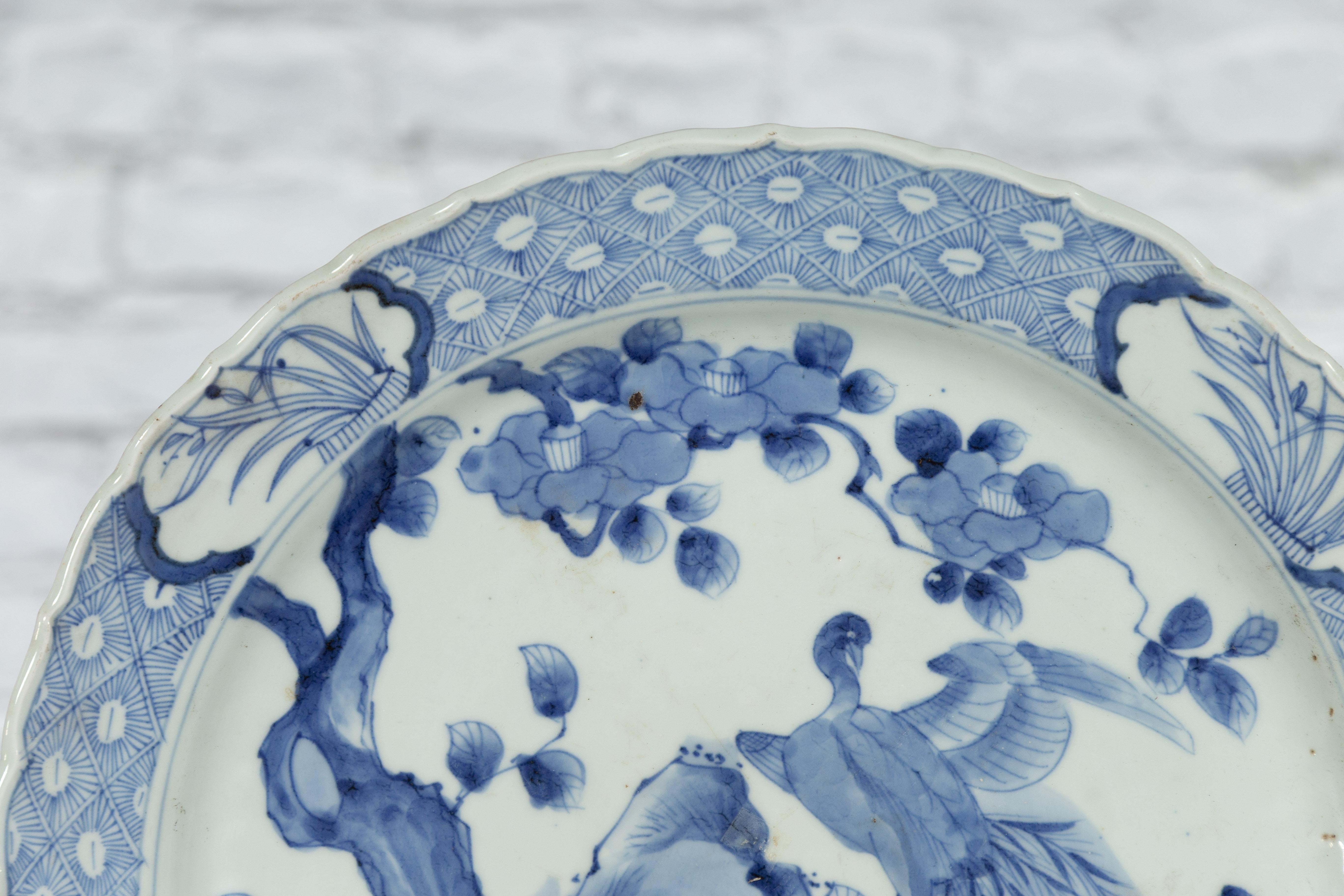 19th Century Japanese Porcelain Plate with Painted Blue and White Bird Décor For Sale 5
