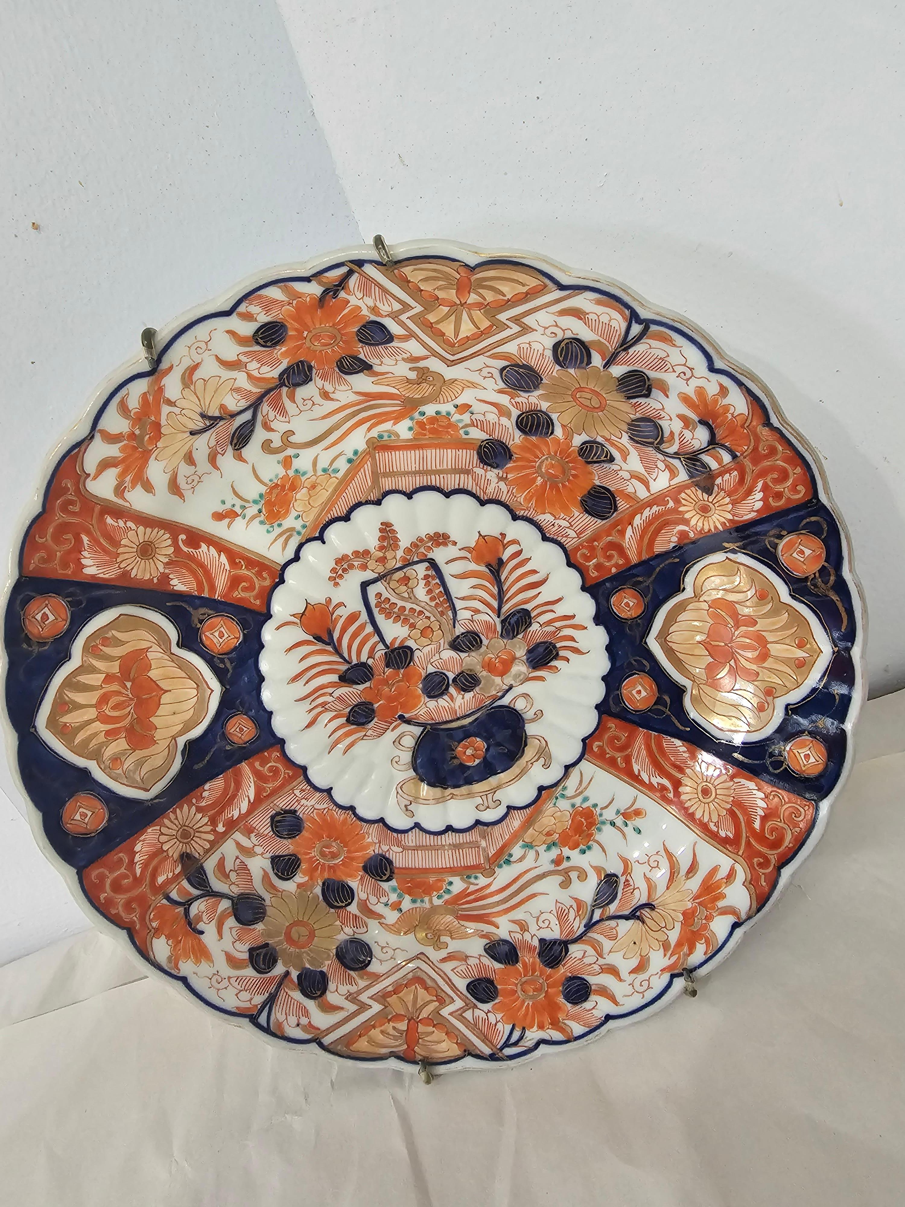 A 19th Century Large Japanese Imari Decorative Platter in great antique construction . Measures 10