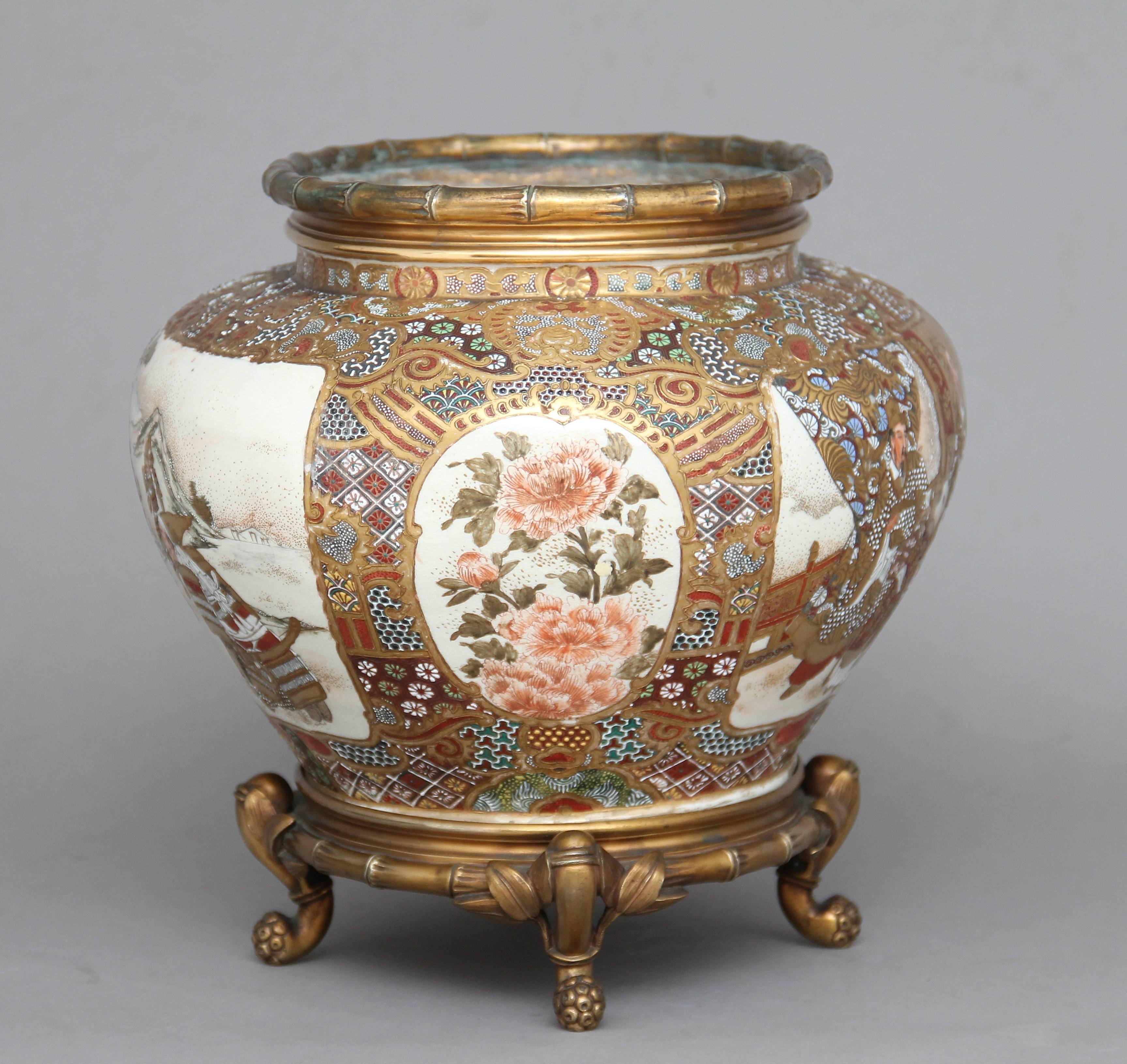 A lovely quality 19th century Japanese Satsuma and ormolu-mounted bowl, the oval shaped top decorated with an ormolu mock bamboo rim, the bowl depicting two scenes, one of a group of samurai warriors in a Japanese country side, the other depicting a