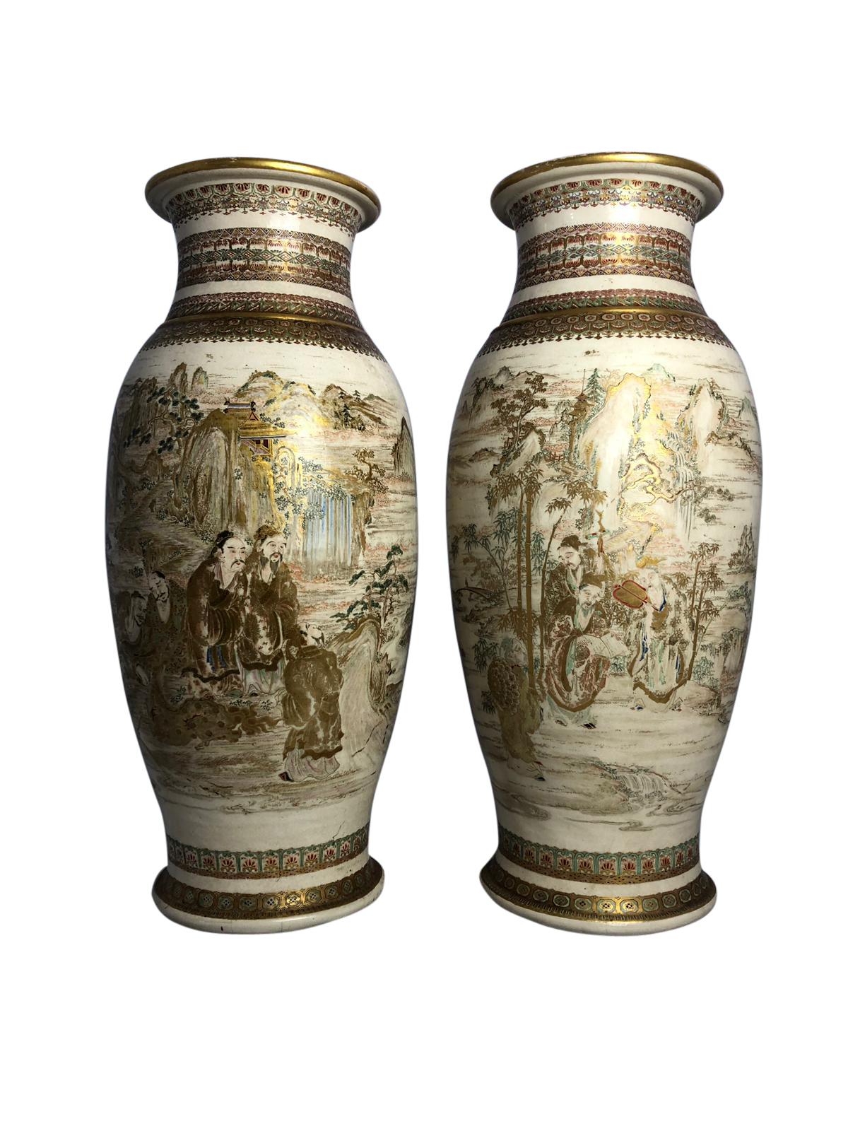 A superb pair of 19th century, Japanese Satsuma vases. Each with beautiful golds, greens and yellows. The pair have matching vase features a bulbous shape with the traditional smooth rim, over the body decorated with a continuous scene depicting