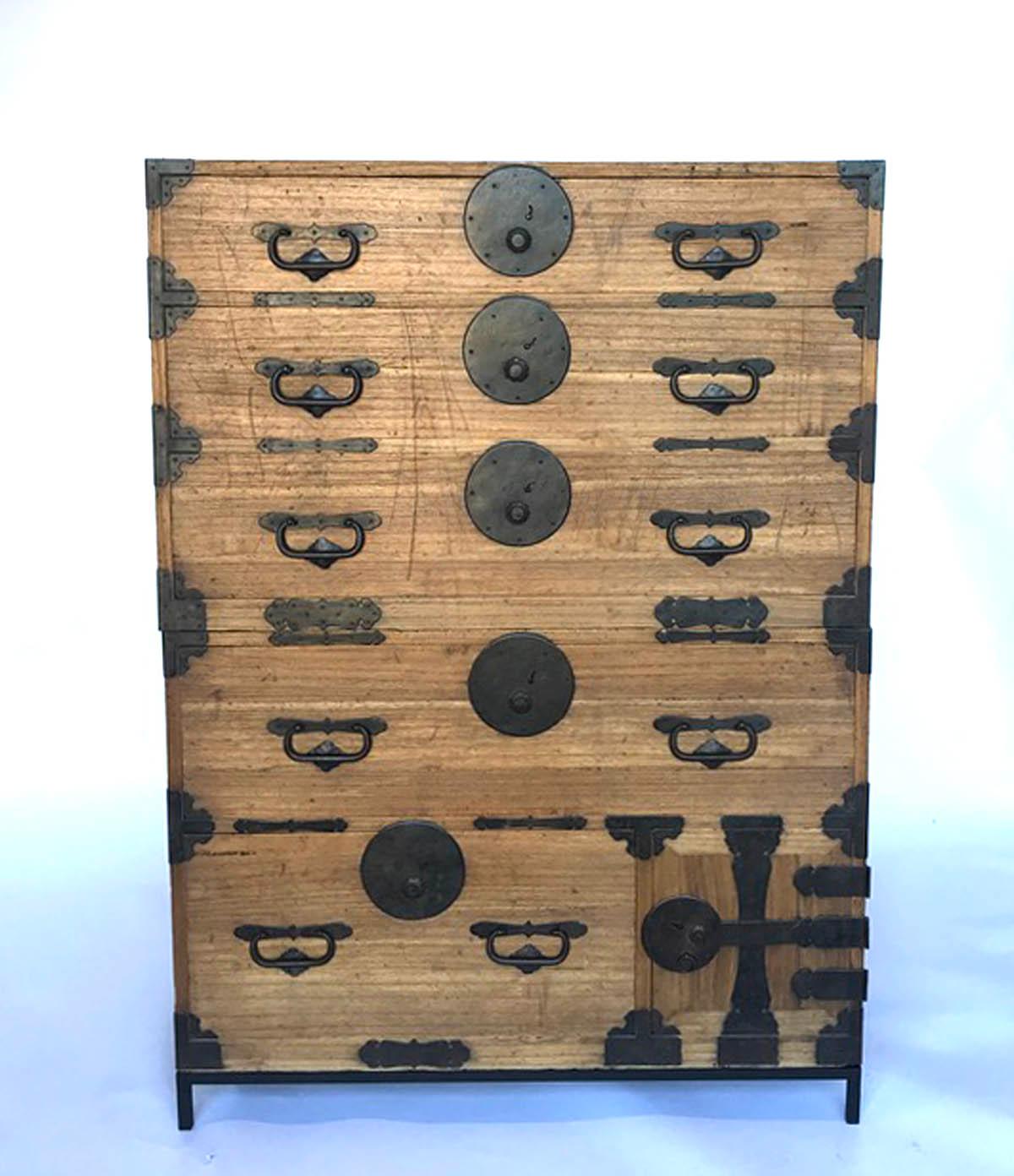 Very functional, hinoki wood Japanese tansu on custom iron base. This tansu has five drawers and one small compartment with shelf. All original. Works as a chest of drawers or can be separated and used as nightstands or side tables. Smoothly working