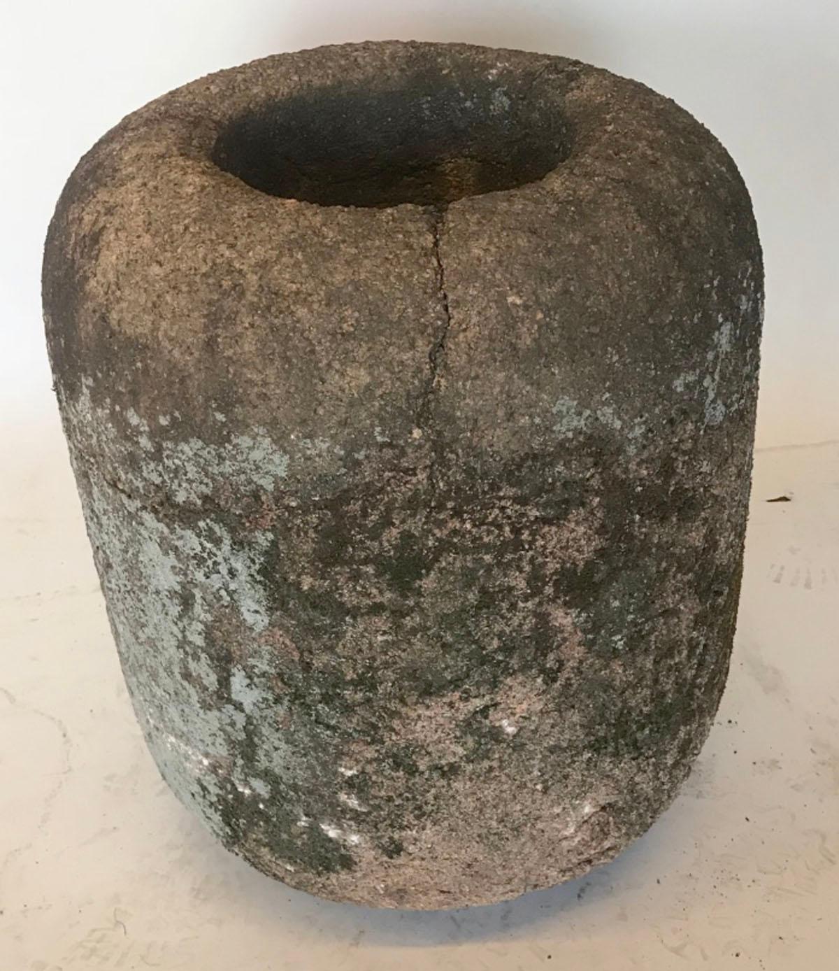 Very old, may be older than 19th century, stone water reservoir used to collect water in a Japanese garden water feature. Old natural aged patina with lichen and moss in green, gray, brown and pink tones.