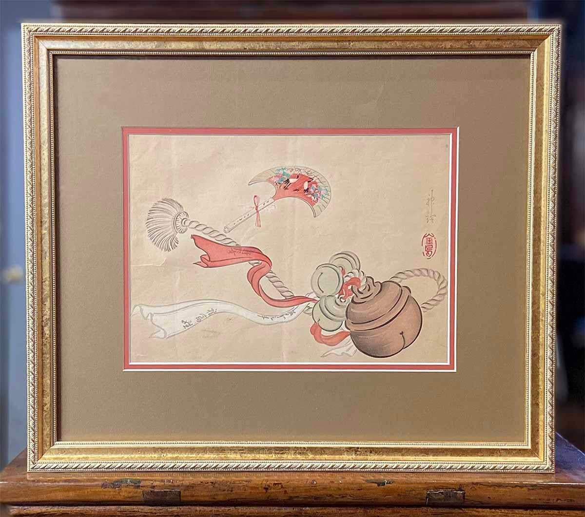 An antique Japanese woodblock print from the 19th century depicting a ceremonial tassel. Created in Japan during the 19th century, this woodblock print attracts our attention with its depiction of ceremonial objects: a ribbon-tied tassel with bells