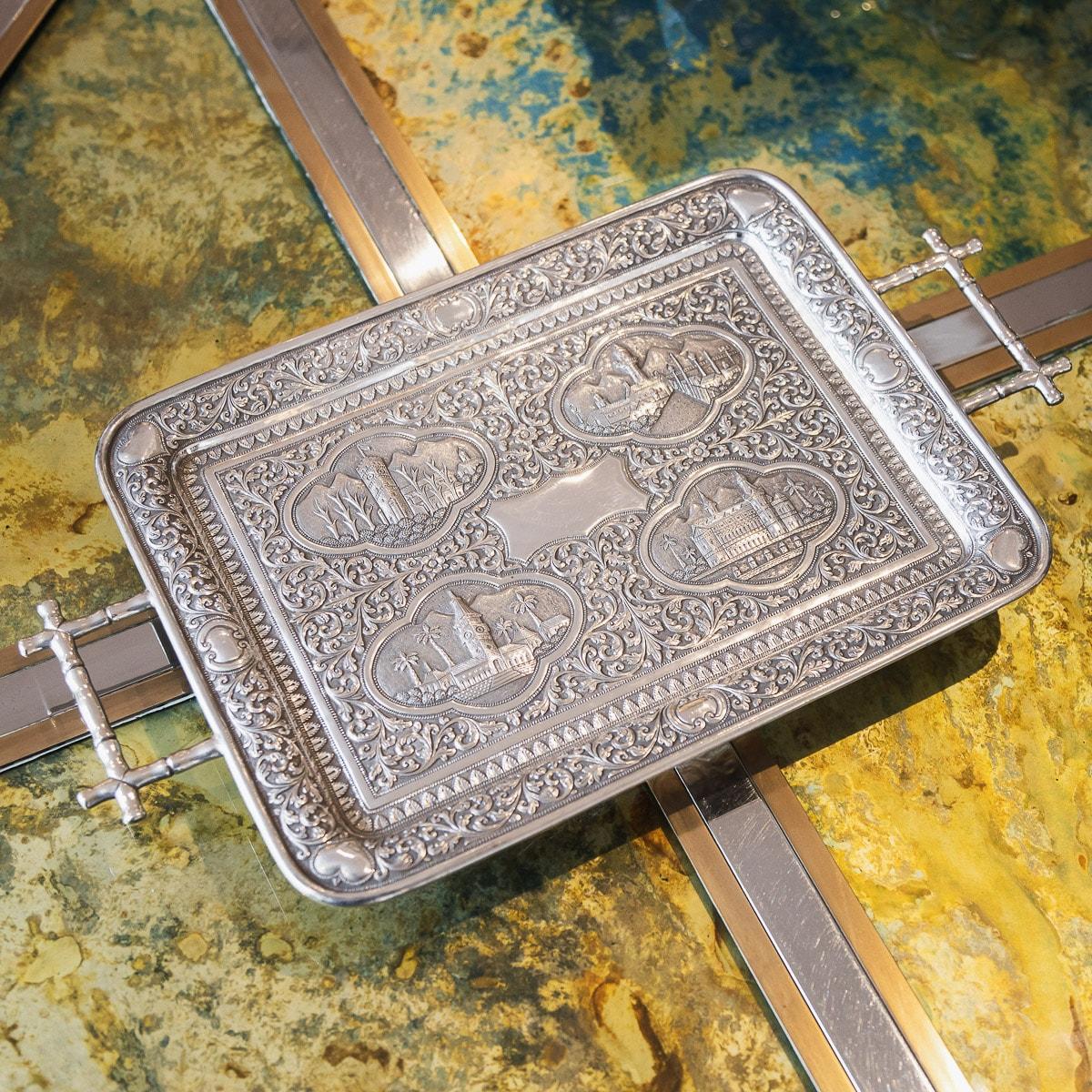 Antique late-19th century Karachi Kutch (Cutch), (Pakistan region) handcrafted solid silver tray, of rectangular form mounted with bamboo shaped handles, finely chased throughout with scrolling leaves and floral patterns on a finely tooled matted