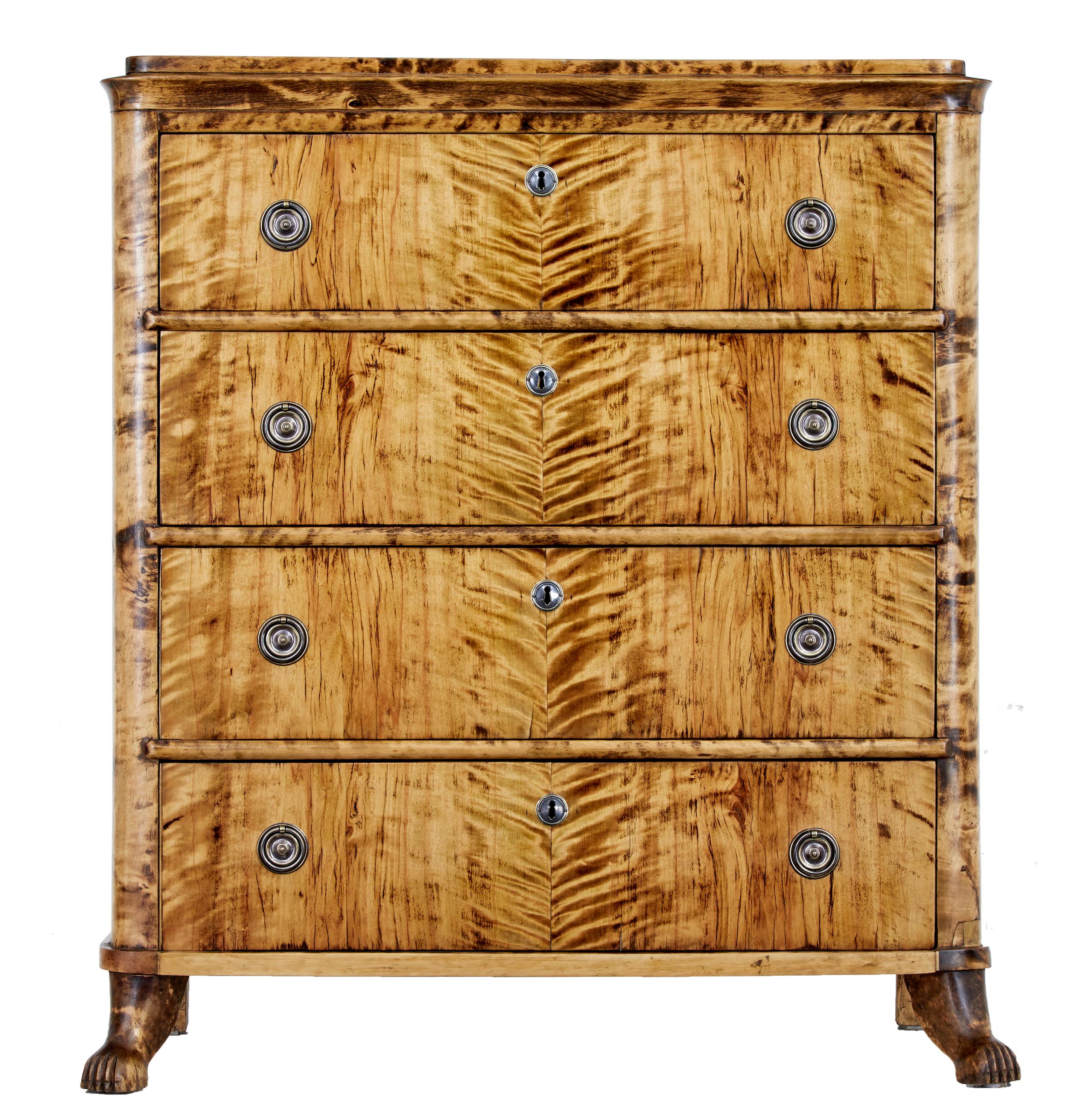 19th century Karl Johan period birch chest of drawers circa 1840.

Striking 4 drawer Swedish chest of drawers from the king Karl Johan period. Shaped top surface, below which are 4 equal depth drawers beautifully veneered in match book