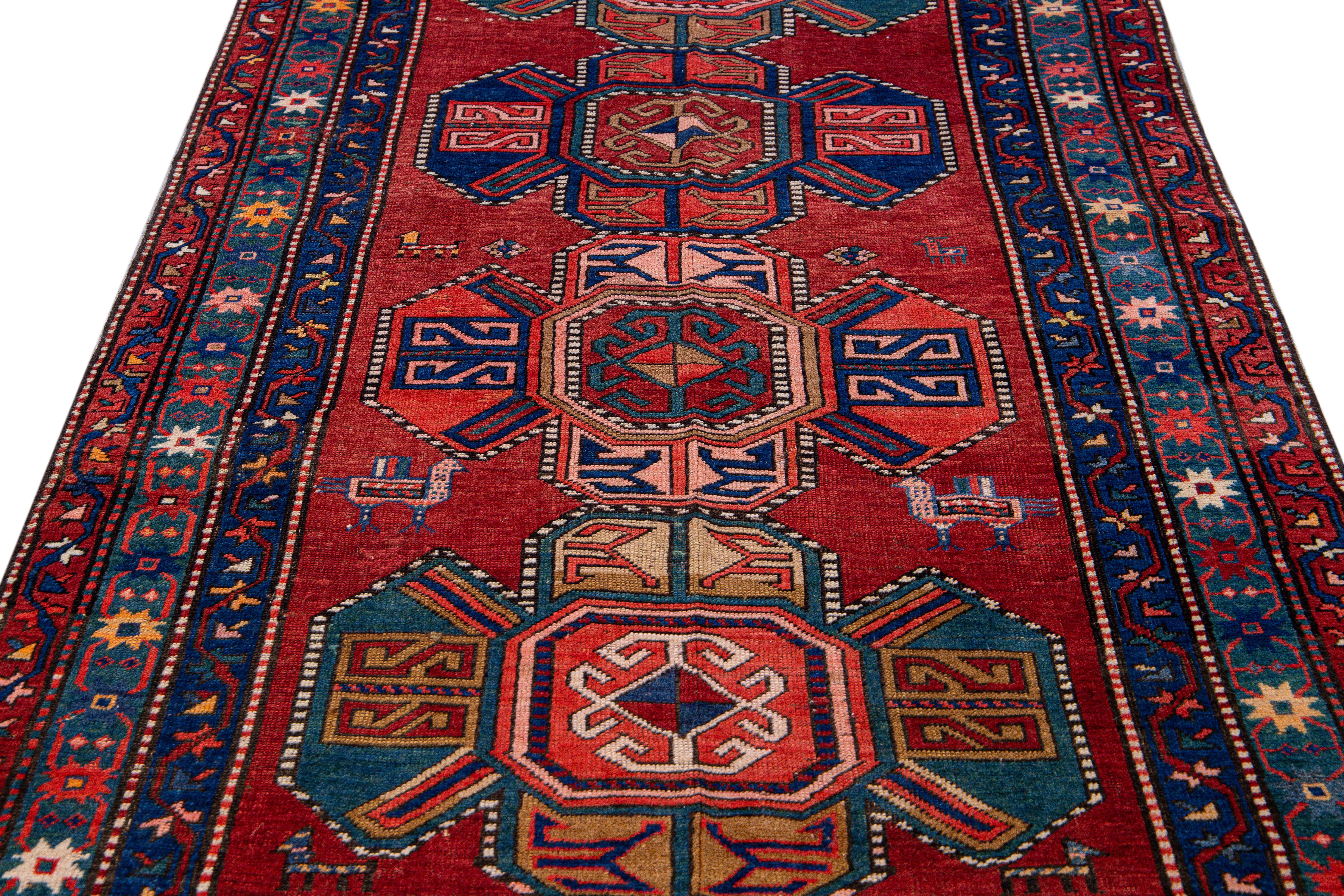 Caucasian 19th Century Kazak Multicolor Tribal Motif Red Wool Runner For Sale