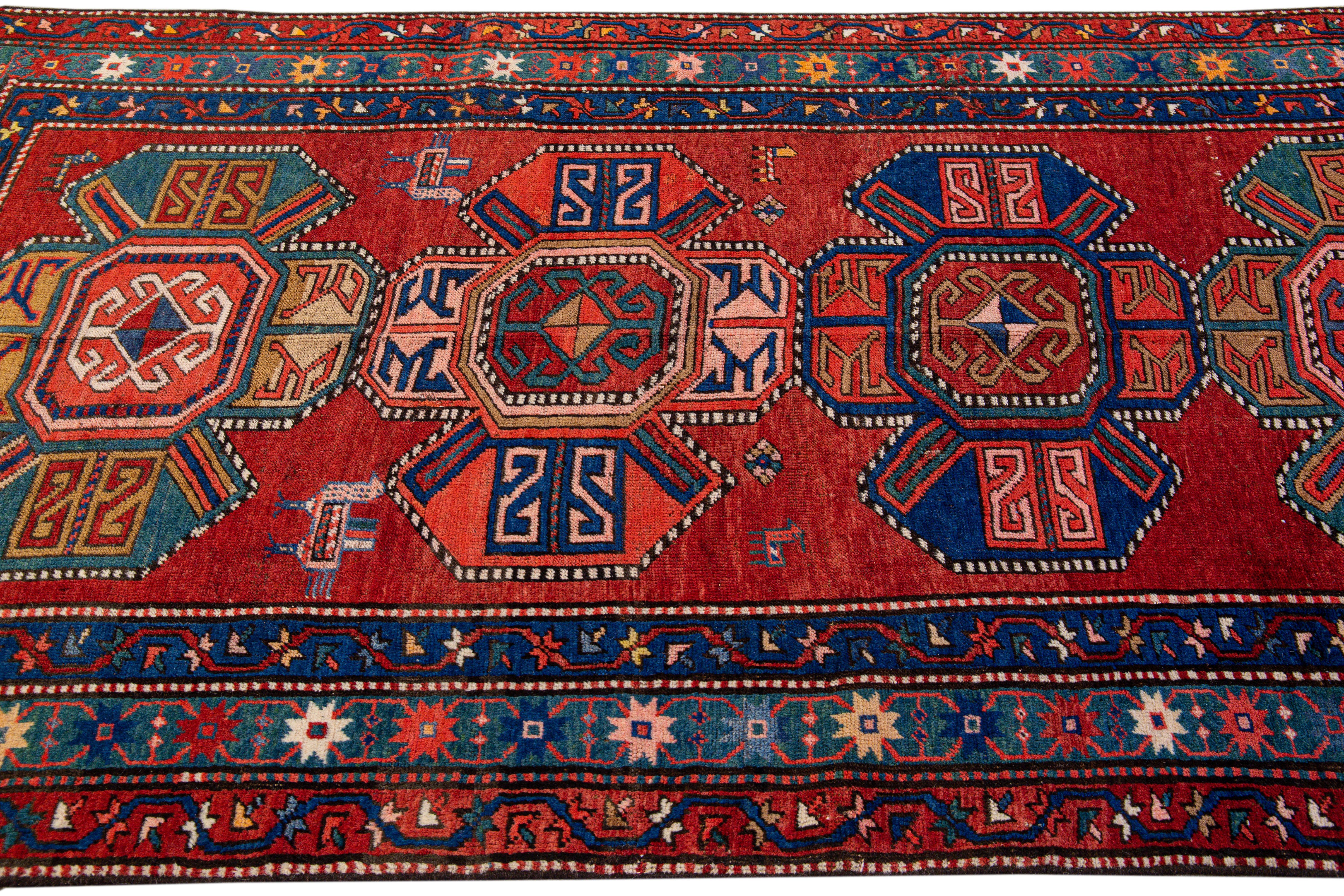 Late 19th Century 19th Century Kazak Multicolor Tribal Motif Red Wool Runner For Sale