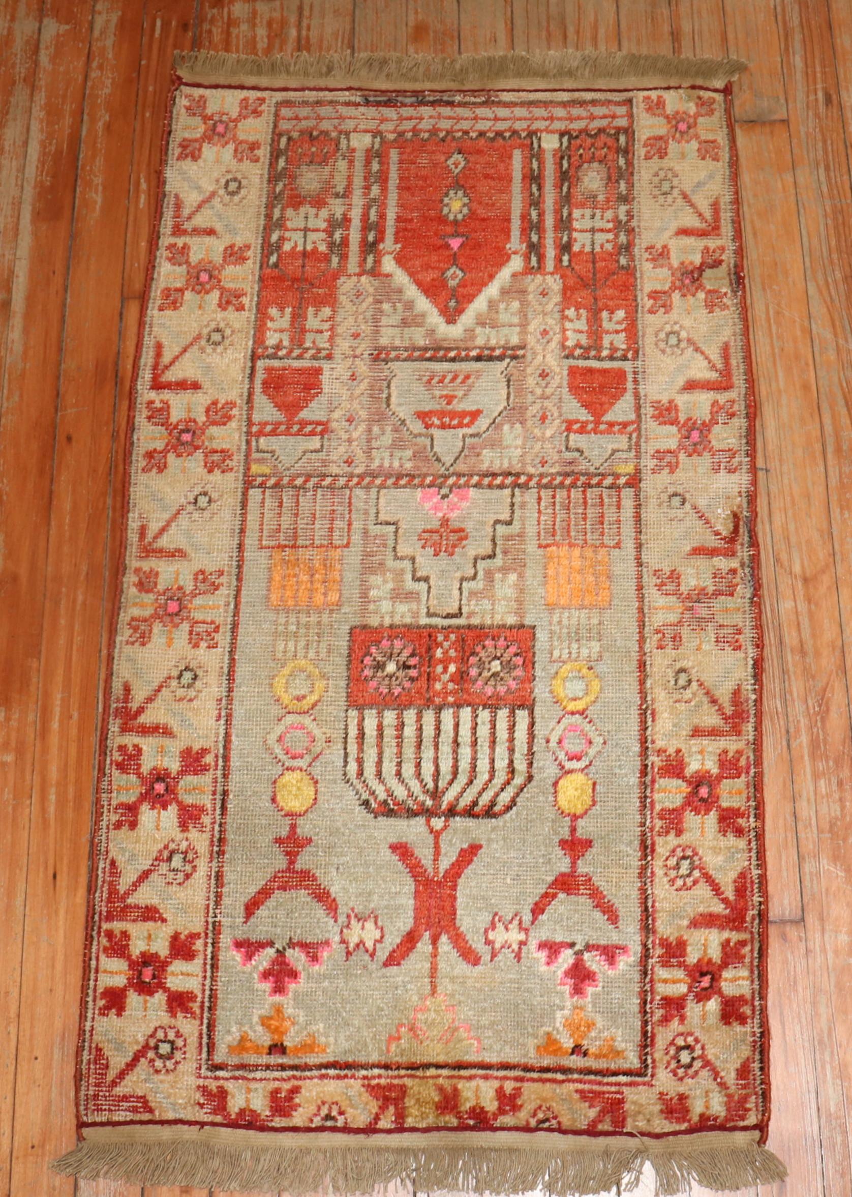 A rare throw Size Antique Khotan Rug from the late 19th century
 Purchased from a collection in Washington DC.

Measures: 2' x 3'7'.