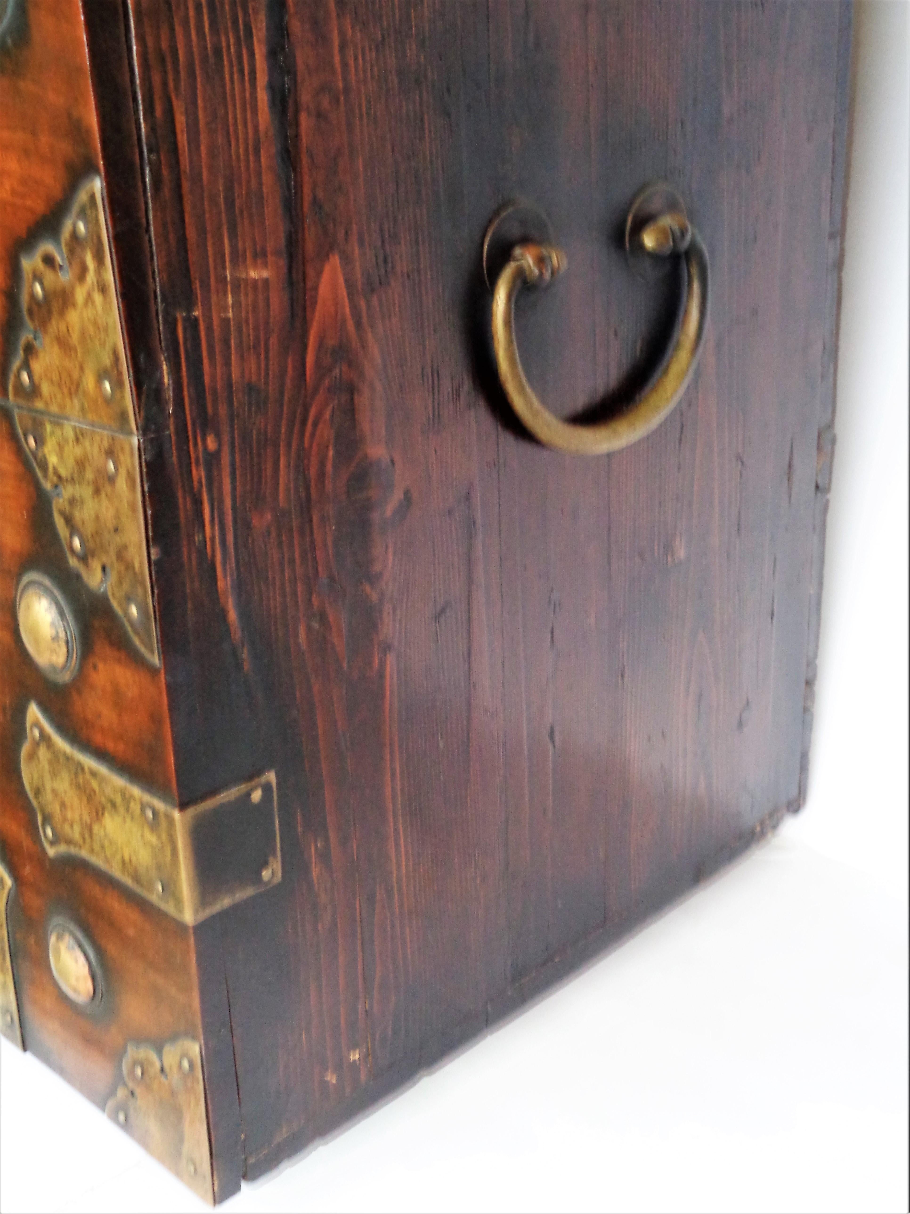 Antique 19th century Korean tansu ( drop front bandaji tansu chest ) in overall beautifully aged rich glowing color patina to the well figured elm wood and the finely decorated  hand wrought brass mountings. Look at all pictures and read condition