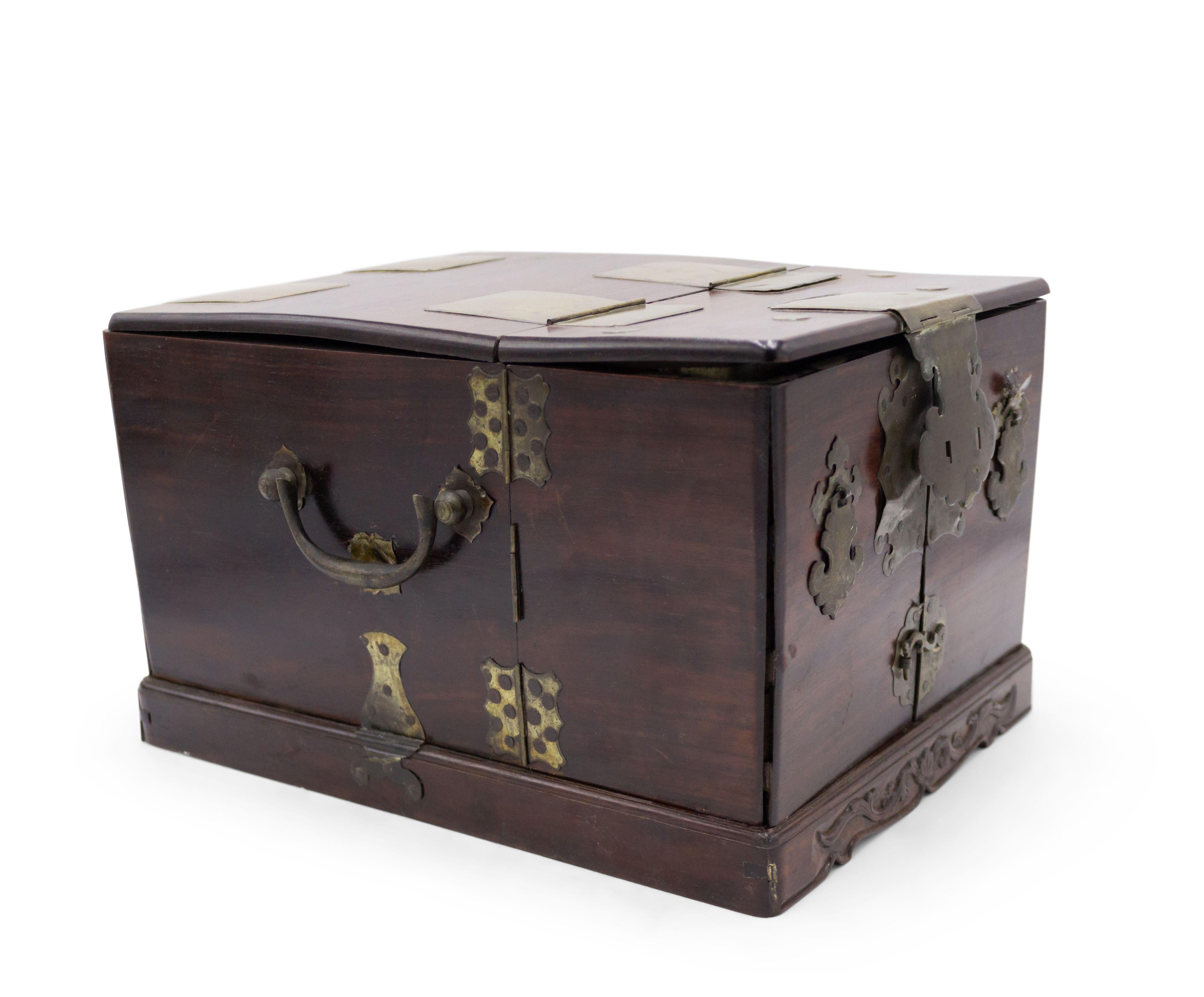 Asian Korean (19th Century) Campaign style rosewood box with brass trim and interior cabinet with a mirror top and drawers with folding side sections.
 