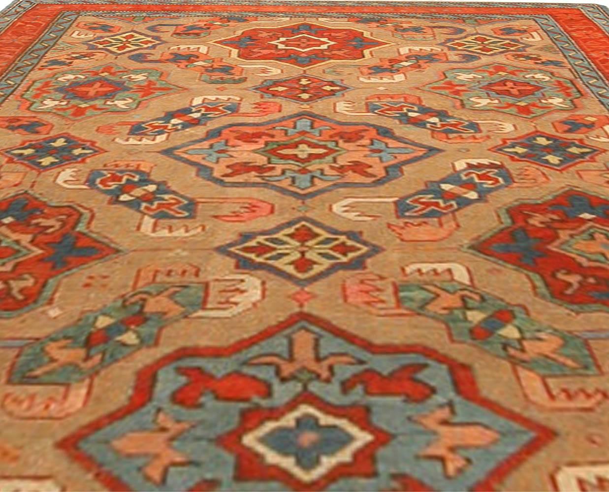 19th century Kuba orange and blue handmade wool rug
Size: 3'7