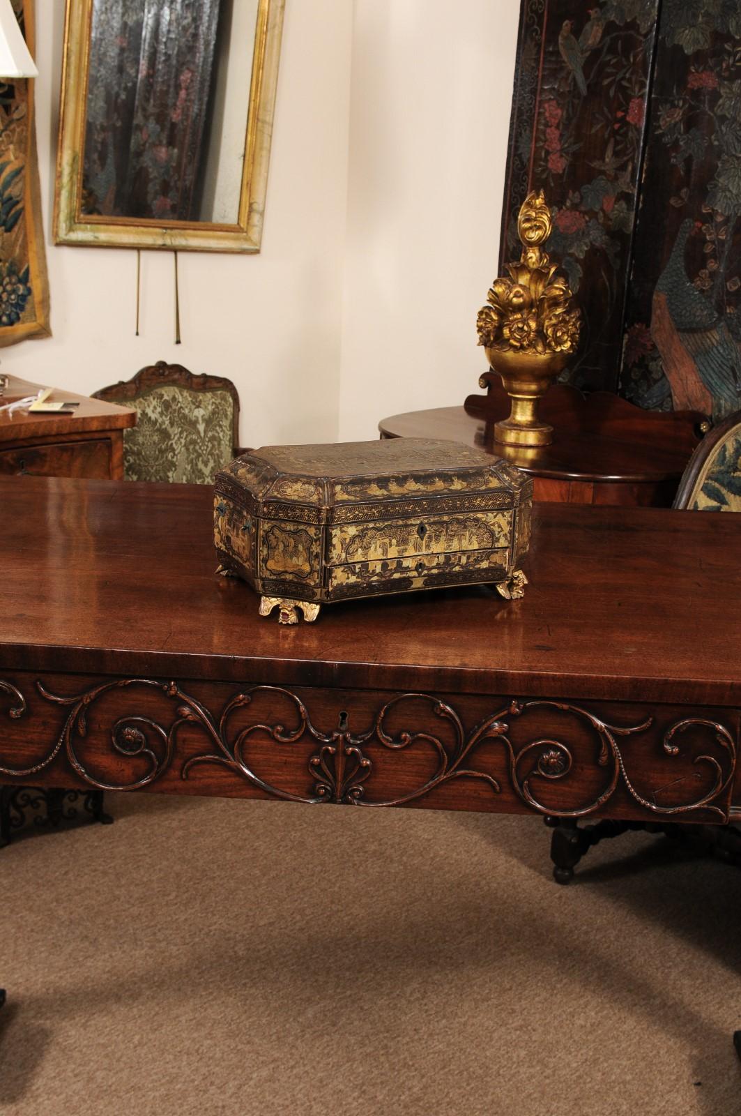The 19th century chinoiserie sewing box with fitted interior, drawer and dragon gilt-wood carved feet.
