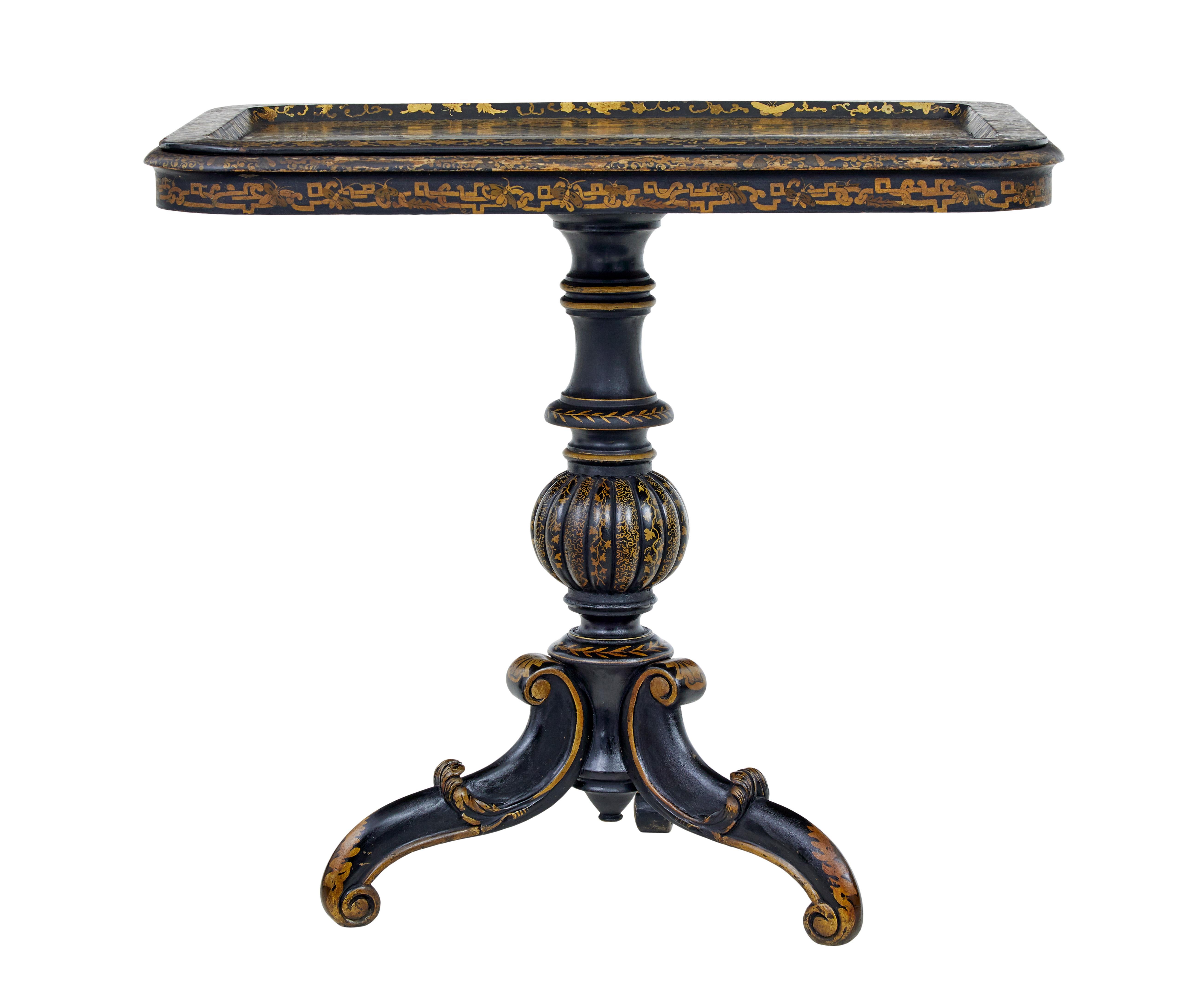 19th century Chinese black lacquered tray table circa 1880.

Beautifully hand painted and decorated tray table.  Black lacquered base colour, profusely painted in gold leaf, depicting scenes of a traditional Chinese social gathering, with