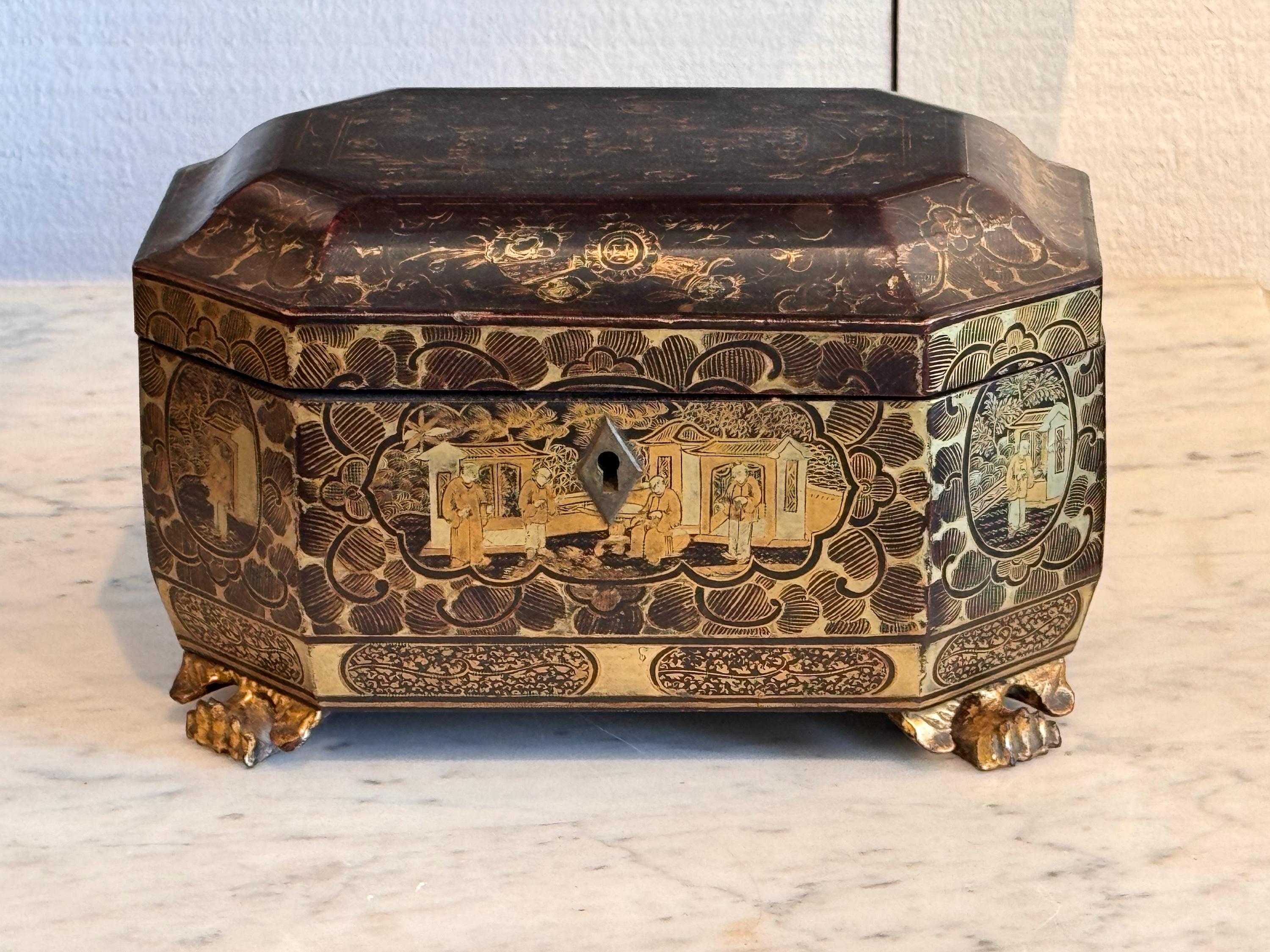 A papier mache tea caddy. It has all its parts.