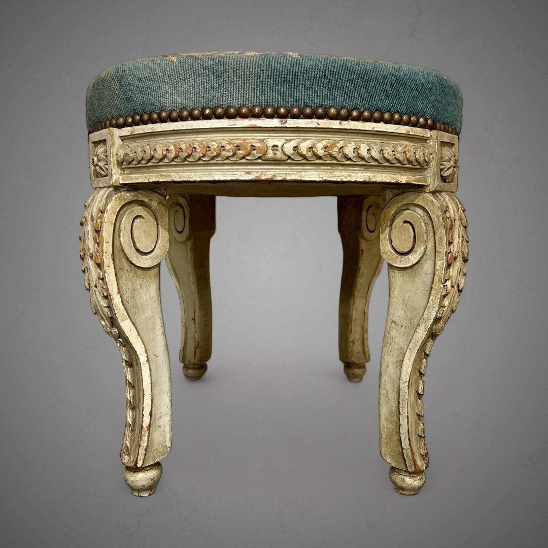 This adorable stool from the Napoleon III era in the 19th century is of exquisite sculpture quality, characterised by deep, precise, and lavish carving. Its four legs feature intricate scrollwork adorned with delicate acanthus leaves and ribbons