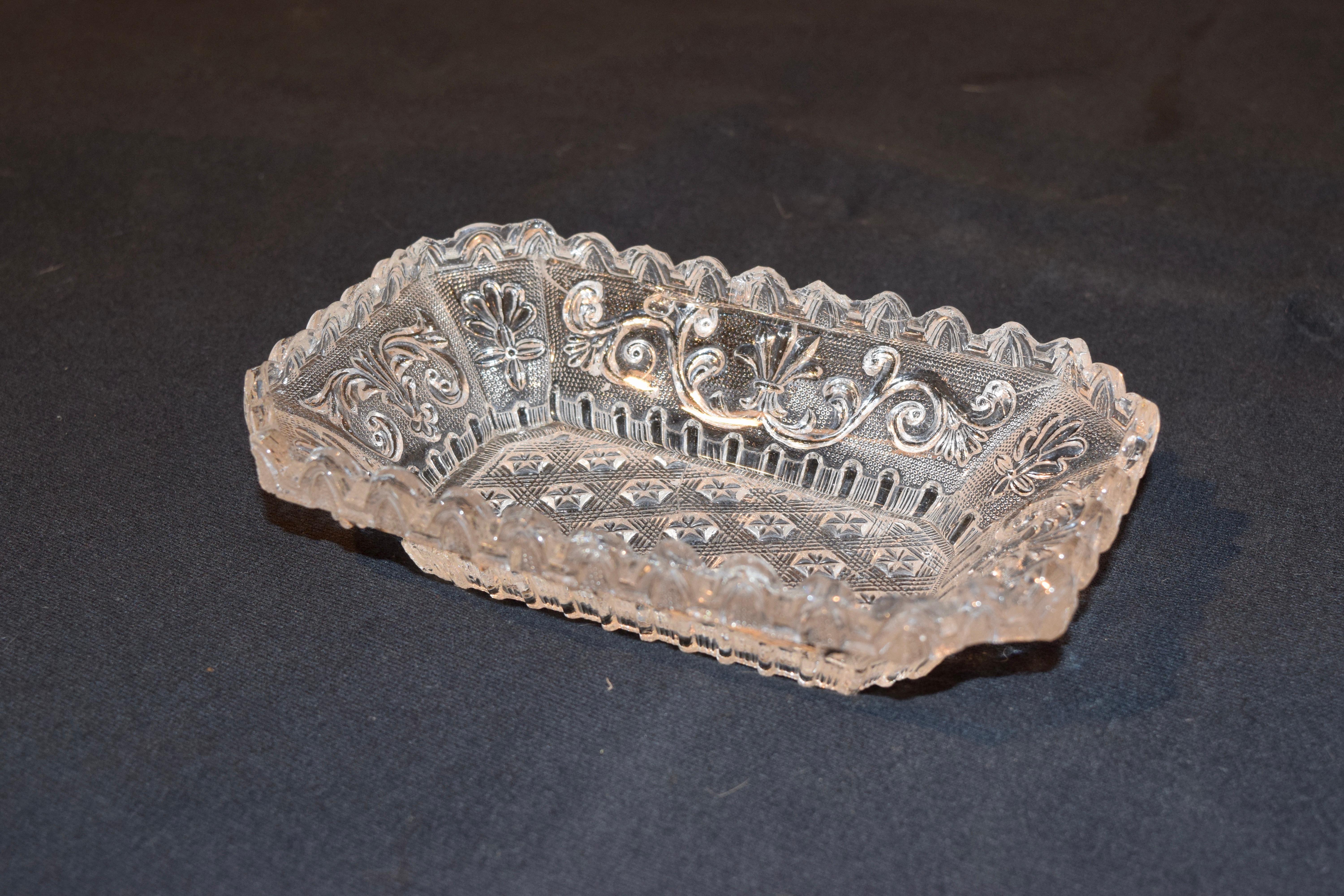 19th century lacy Sandwich pressed glass dish with saw tooth edge and lovely scrolled and star pattern.