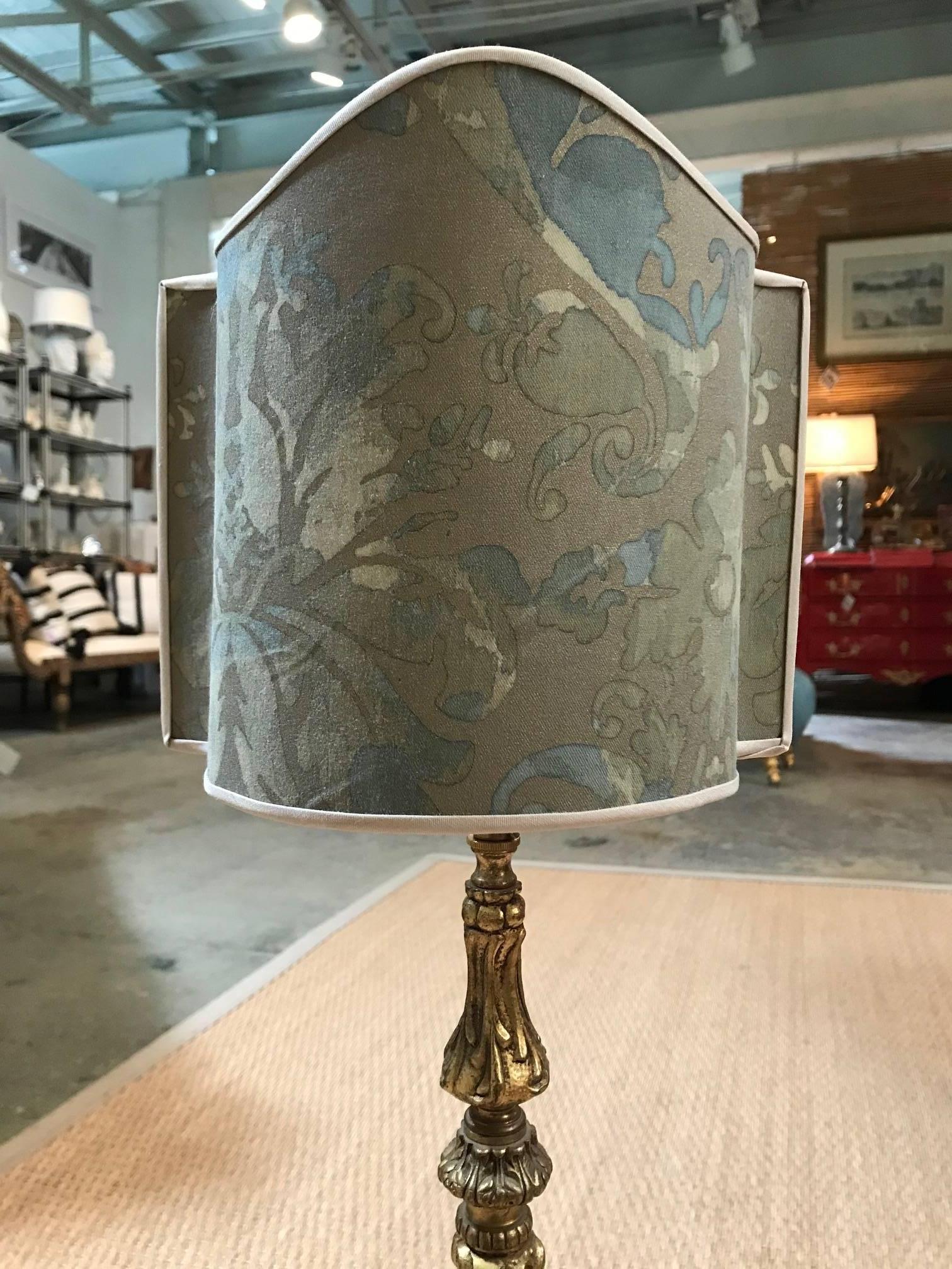 Classical fortuny shaded lamp with ornate decoration.