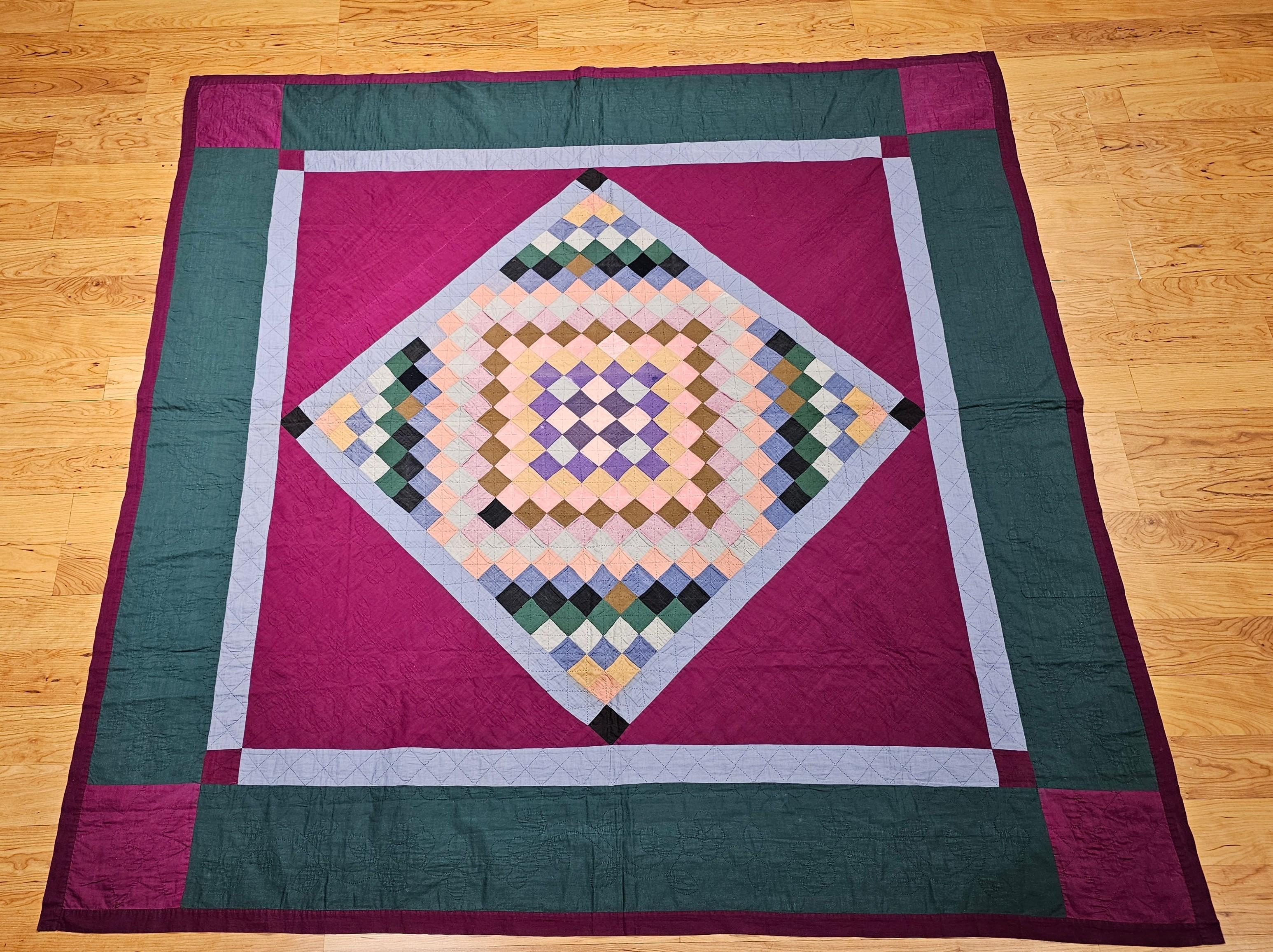 19th century hand-stitched and quilted American Amish Quilt in a” Diamond in a Square Trip Around the World” pattern from Lancaster County, Pennsylvania.   The quilt has a very fine hand stitching  The Amish community in Pennsylvania hand craft the